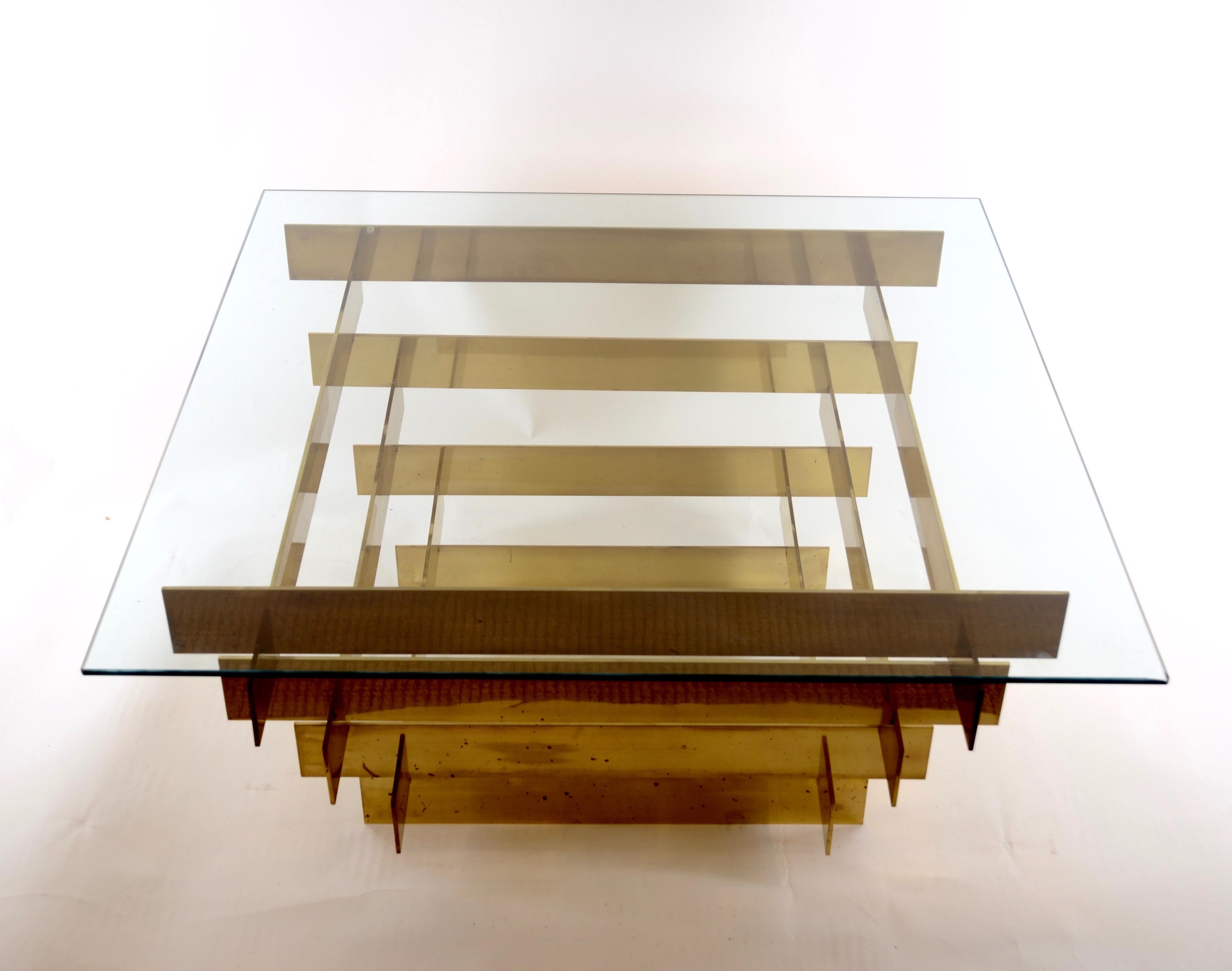 A coffee table designed by David Hicks, circa 1970s. Made in gilt-brass and glass.
Retailed by Galleria Pitti, Rome.
 