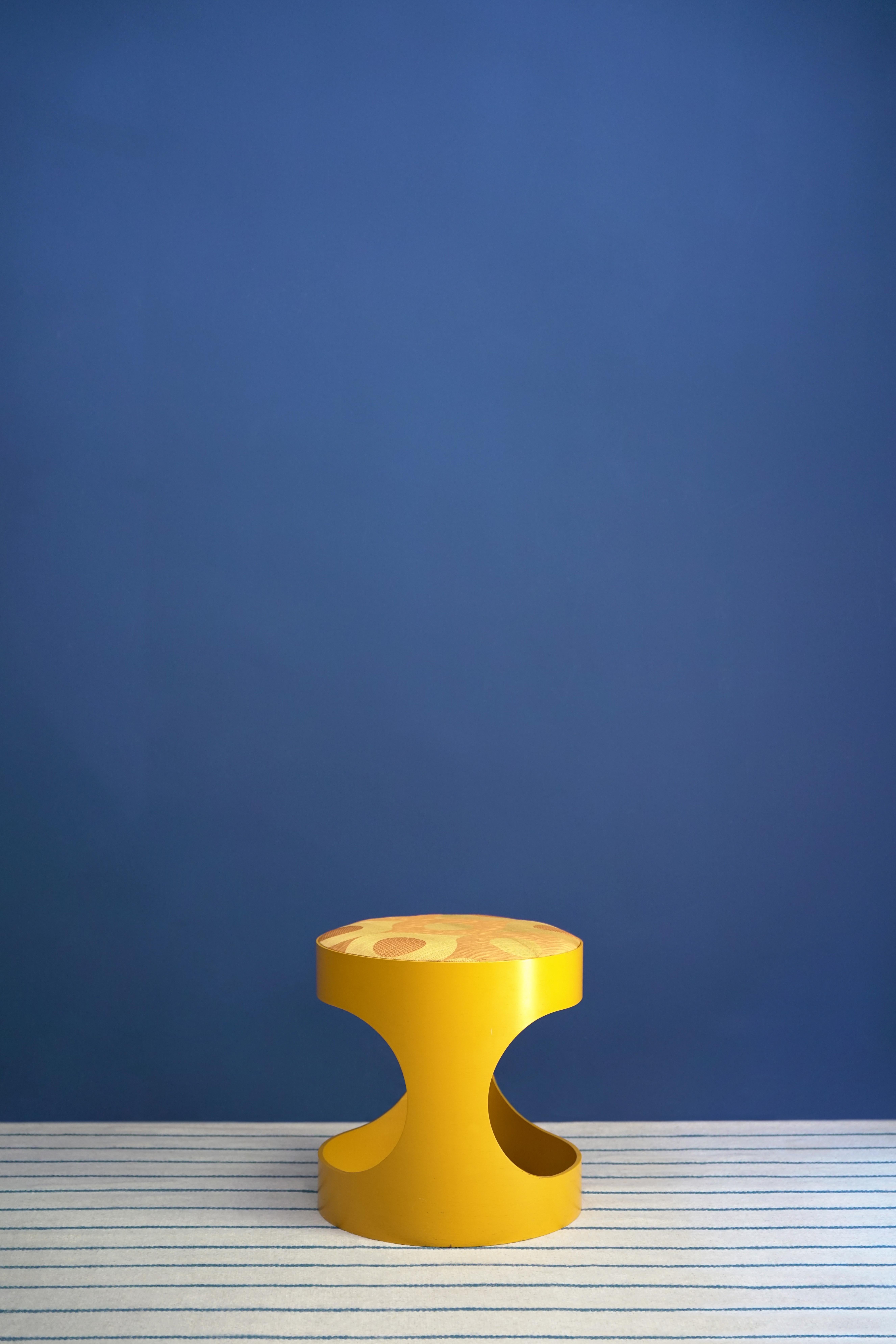 1960's stool made of curved wood lacquered in yellow with silk seat by David Hicks.

David Nightingale Hicks (25 March 1929 – 29 March 1998) was an English interior decorator and designer, noted for using bold colours, mixing antique and modern