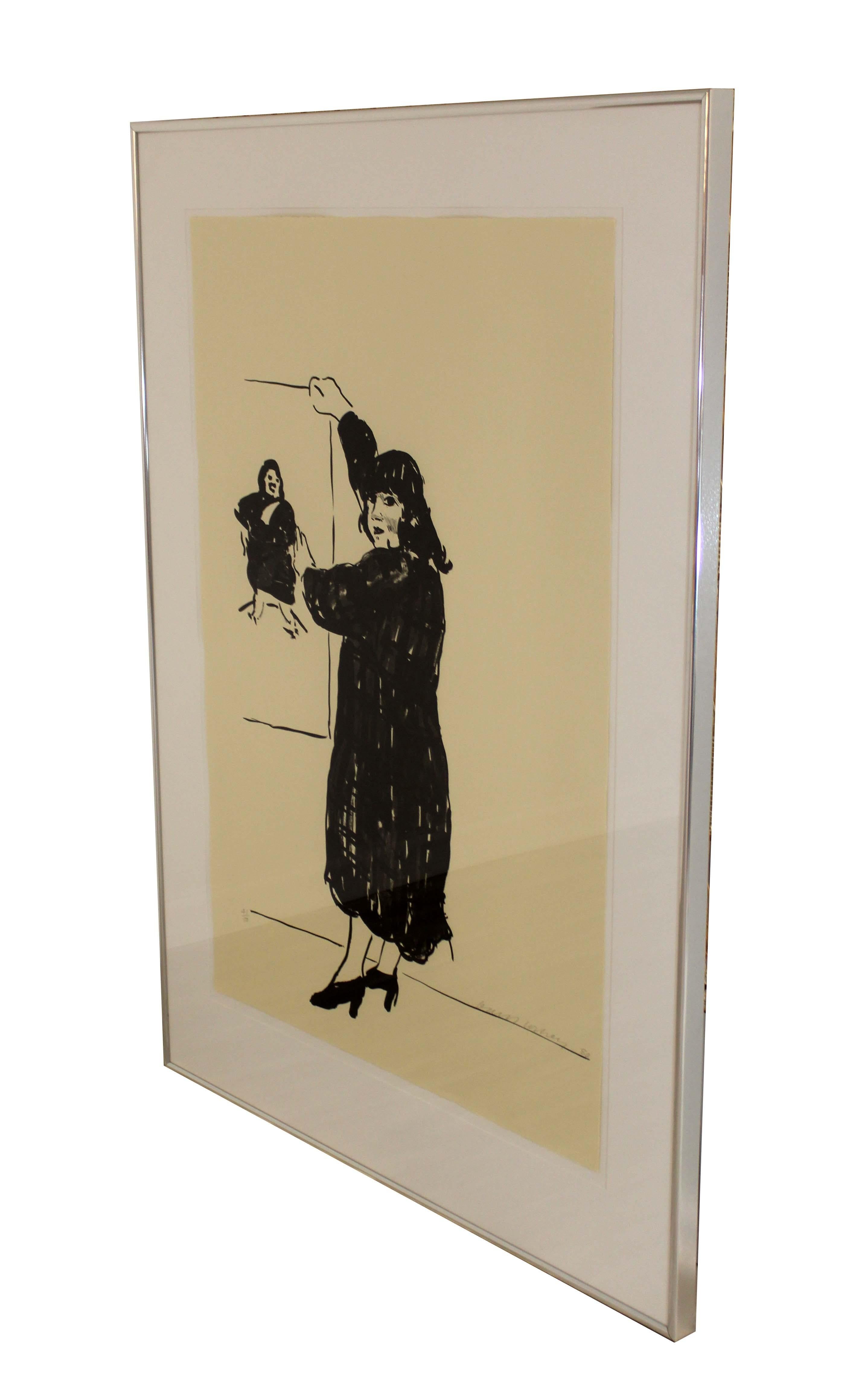 A chic, graphic lithograph titled Ann Looking At Her Picture, with an annotation of 41/50, and hand signed in pencil on bottom right by David Hockney. Dimensions: 58.25 h x 40w (framed). In excellent vintage condition. 

David Hockney (1937- ) is