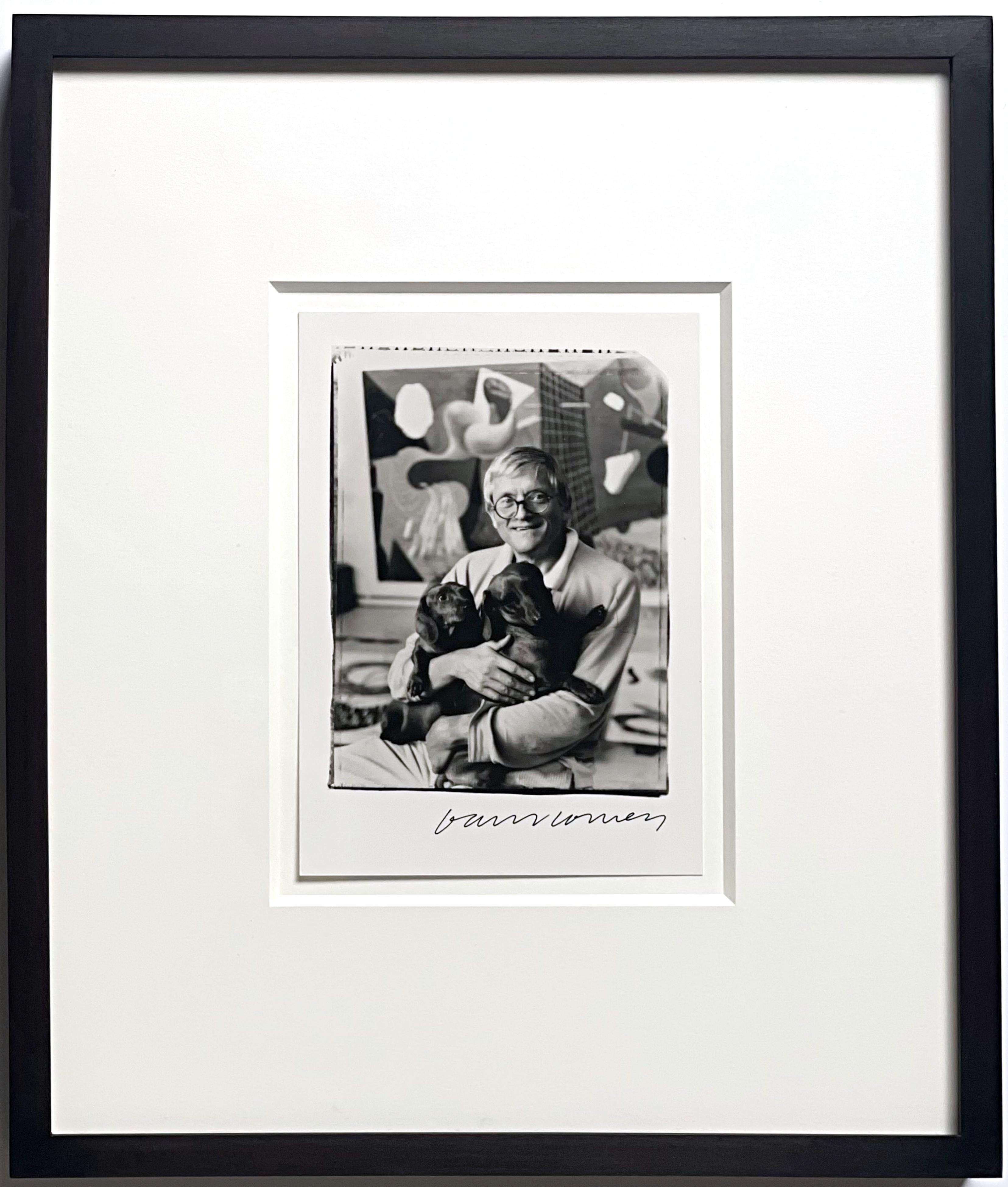 David Hockney with his two dogs Stanley and Boodgie, 1994
Photograph on paper
Hand signed by David Hockney in black marker on the front
Photograph taken by Jim McHugh
Artist copyright stamped on the verso
Throughout his long and illustrious career,