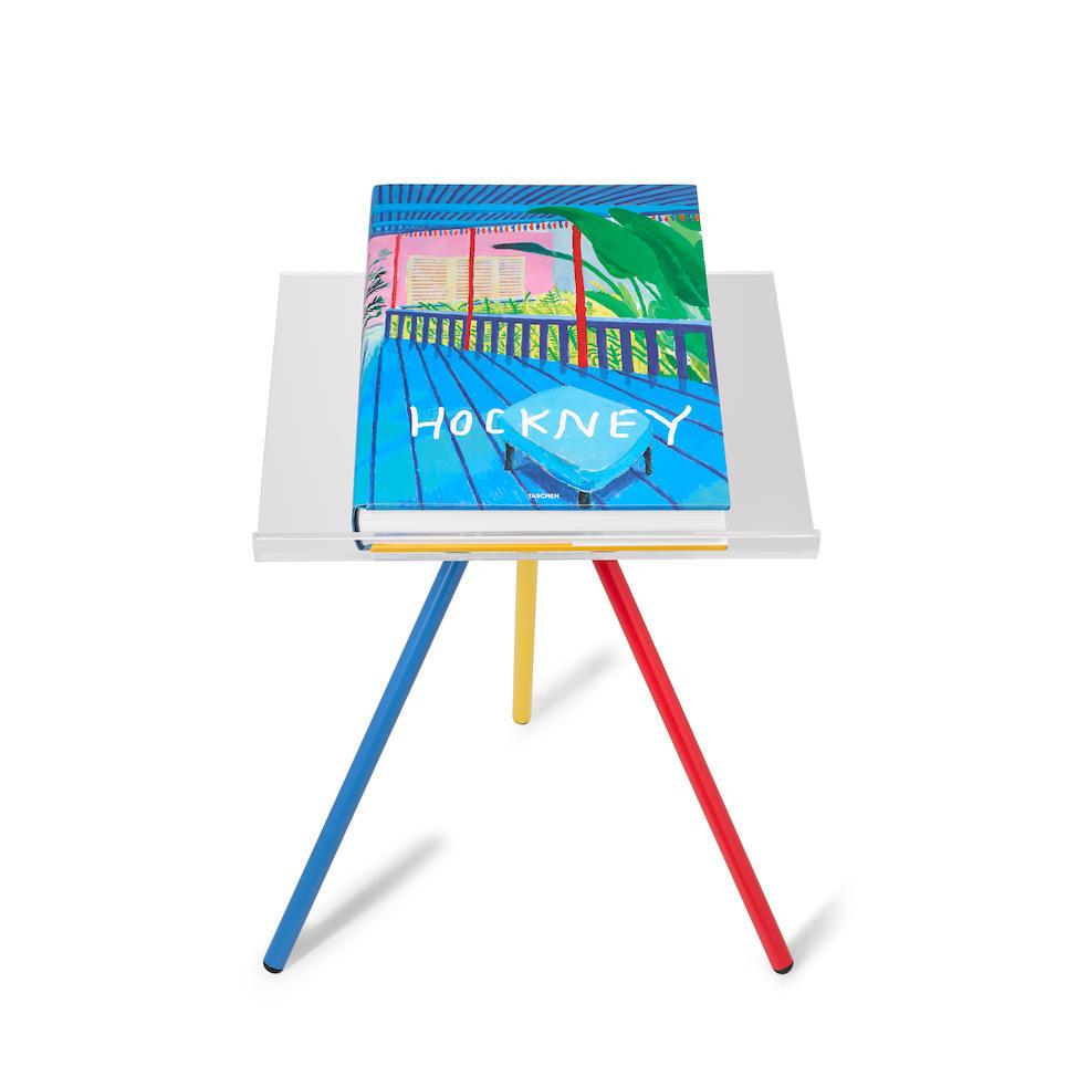 DAVID HOCKNEY (born 1937)
A Bigger Book, 2016
The book, signed on the title-page in black ink 
Stamp numbered 64, from the total edition of 10,000
Published by the artist and Taschen, Berlin, with the painted metal bookstand designed by Marc
