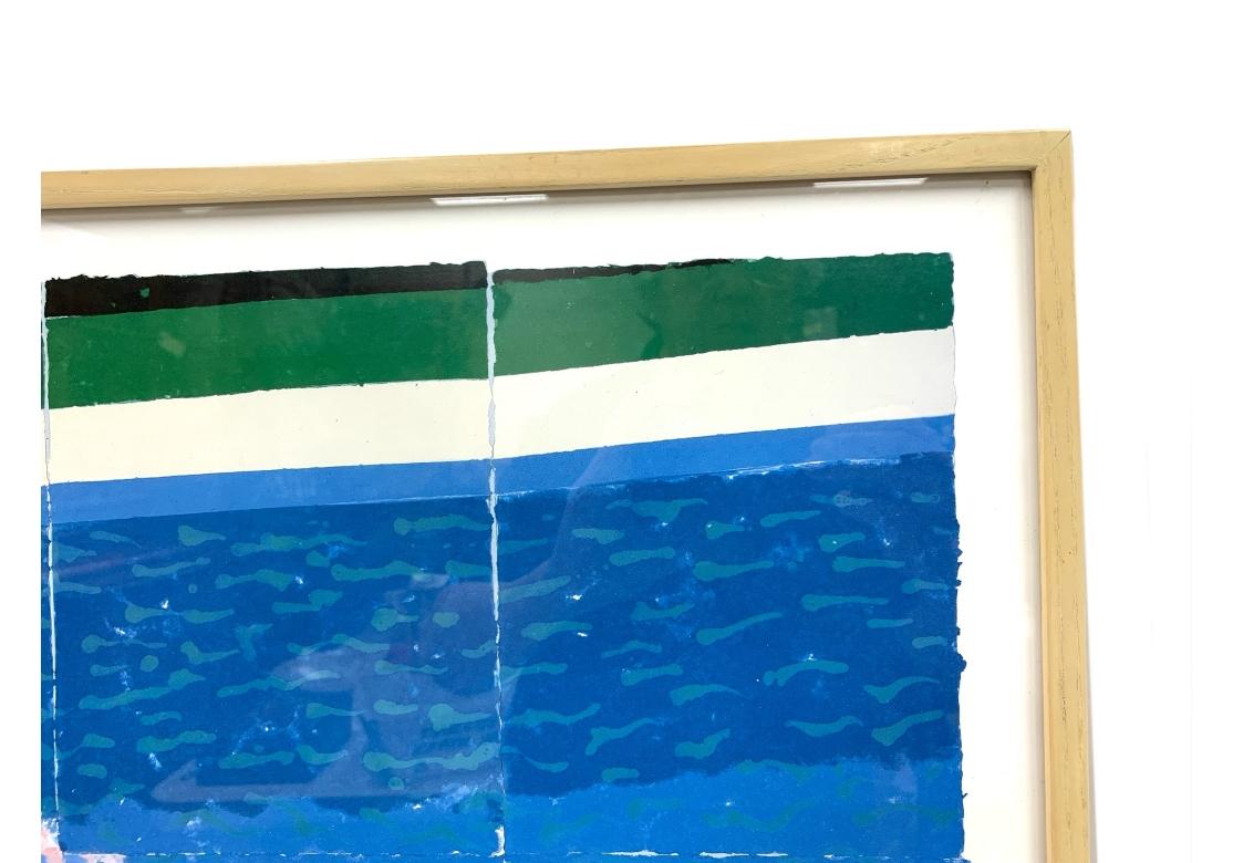 David Hockney print depicting a figure in a swimming pool with a diving board to the left.
Presented in a custom solid wood frame with acrylic cover.
Dimensions: 38