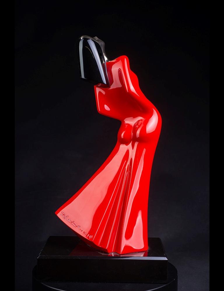 Dancing Lady is an iconic form of David Hostetler's. His first Dancing Lady was carved in white oak and painted in 1979. It wasn't until the early 1990's that David revisited this form in clay to cast into a bronze. His wife Susan posed for the