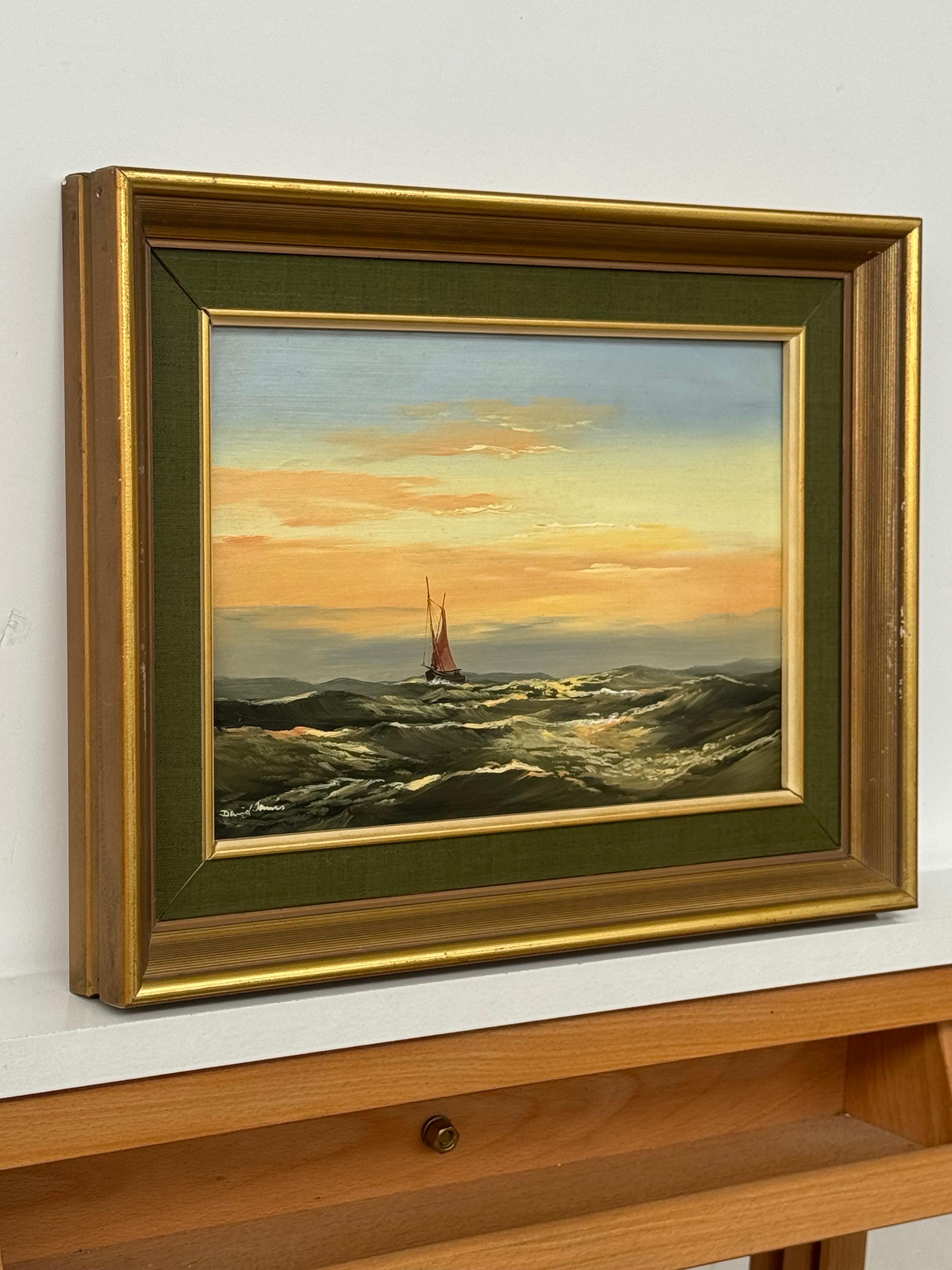 Paysage marin au coucher du soleil avec bateau à voiles rouges et ciel lumineux sur la houle de l'océan huile vintage - Painting de David James