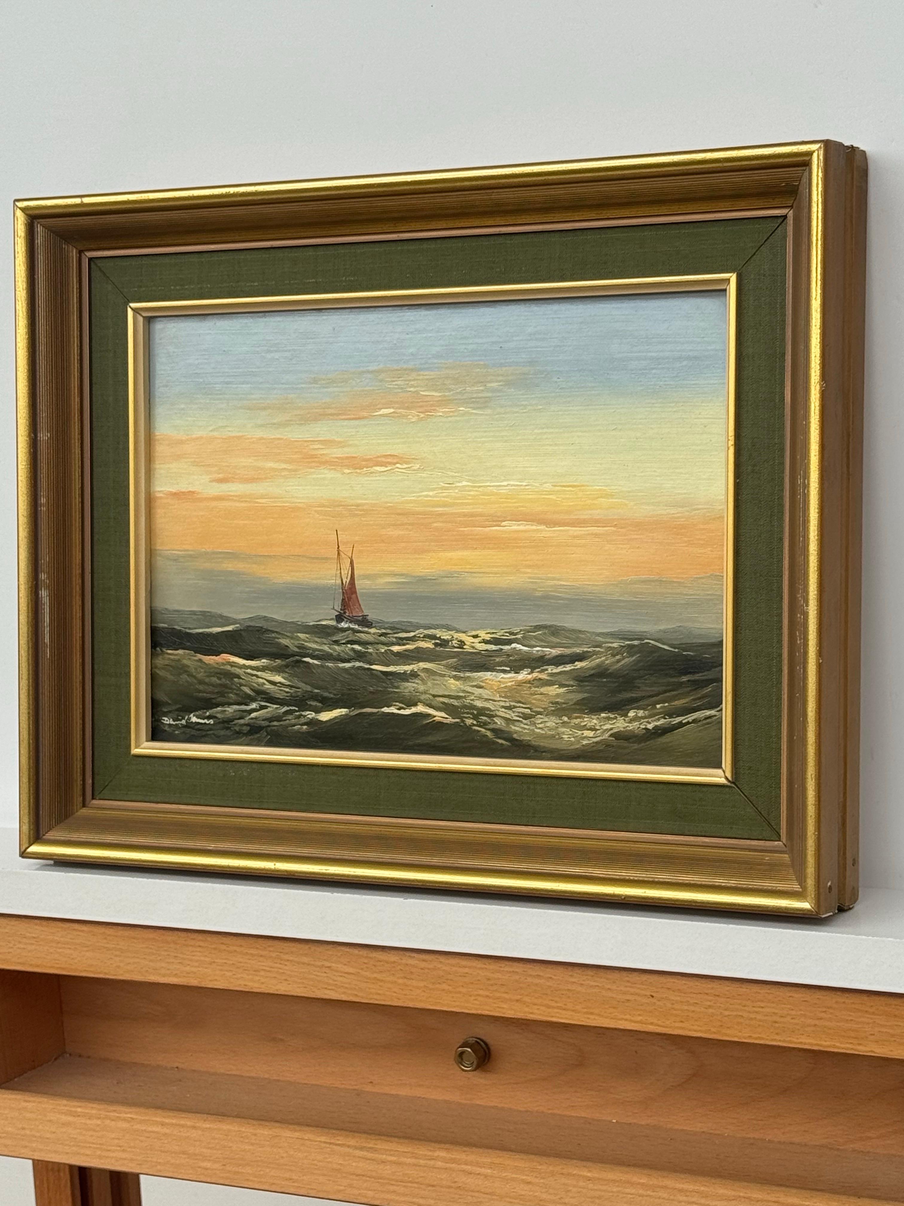 Paysage marin au coucher du soleil avec bateau à voiles rouges et ciel lumineux sur la houle de l'océan huile vintage - Marron Landscape Painting par David James