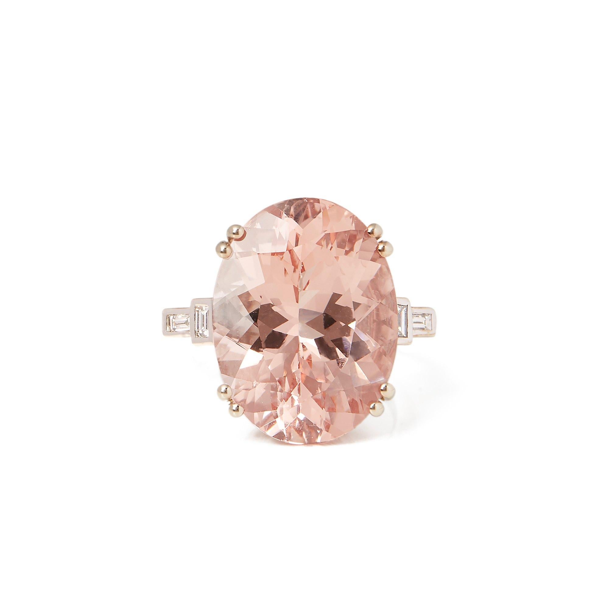This ring designed by David Jerome is from his private collection and features one oval cut morganite totalling 18.49cts sourced in Brazil. Set with round brilliant cut Diamonds totalling 0.30cts mounted in an 18k white gold setting. UK finger size