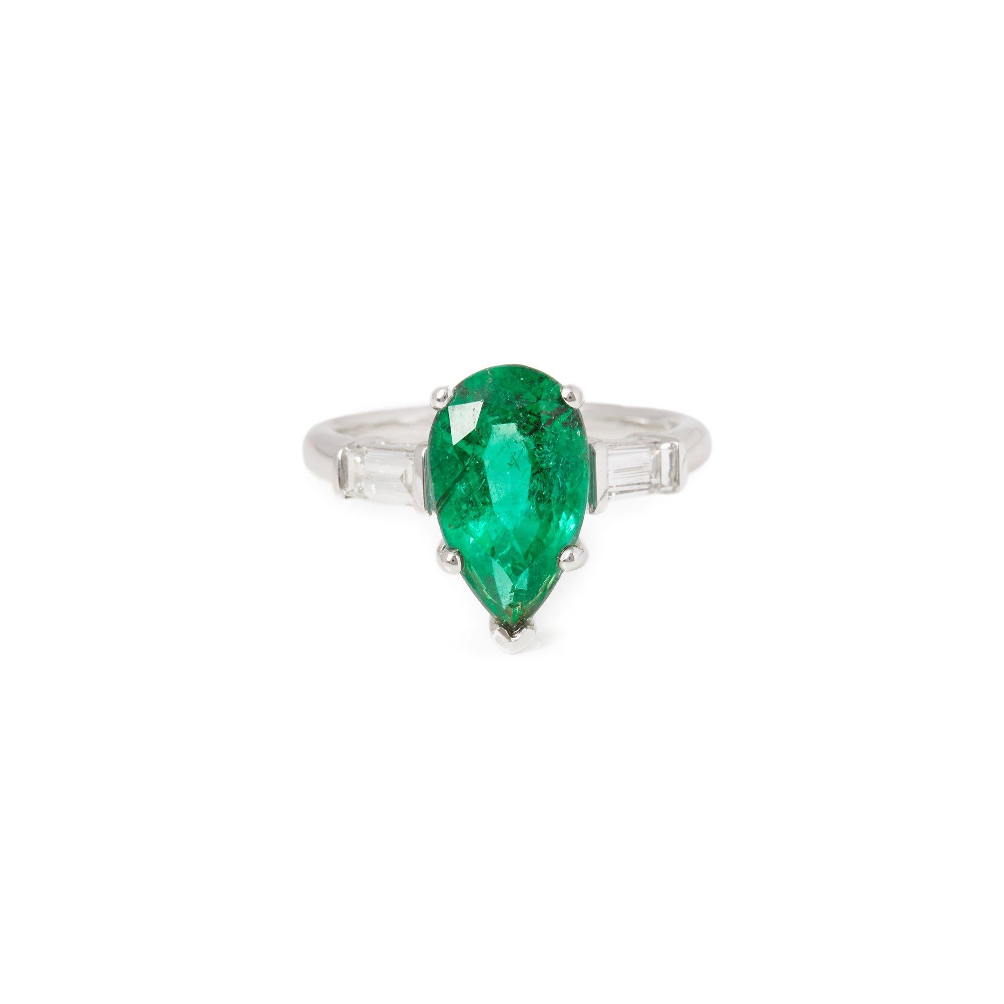 This ring designed by David Jerome is from his private collection and features one pear cut Emerald totalling 3.45cts sourced in Brazil. Set with two tapered baguette cut Diamonds totalling 0.45cts mounted in an 18k white gold setting. UK finger