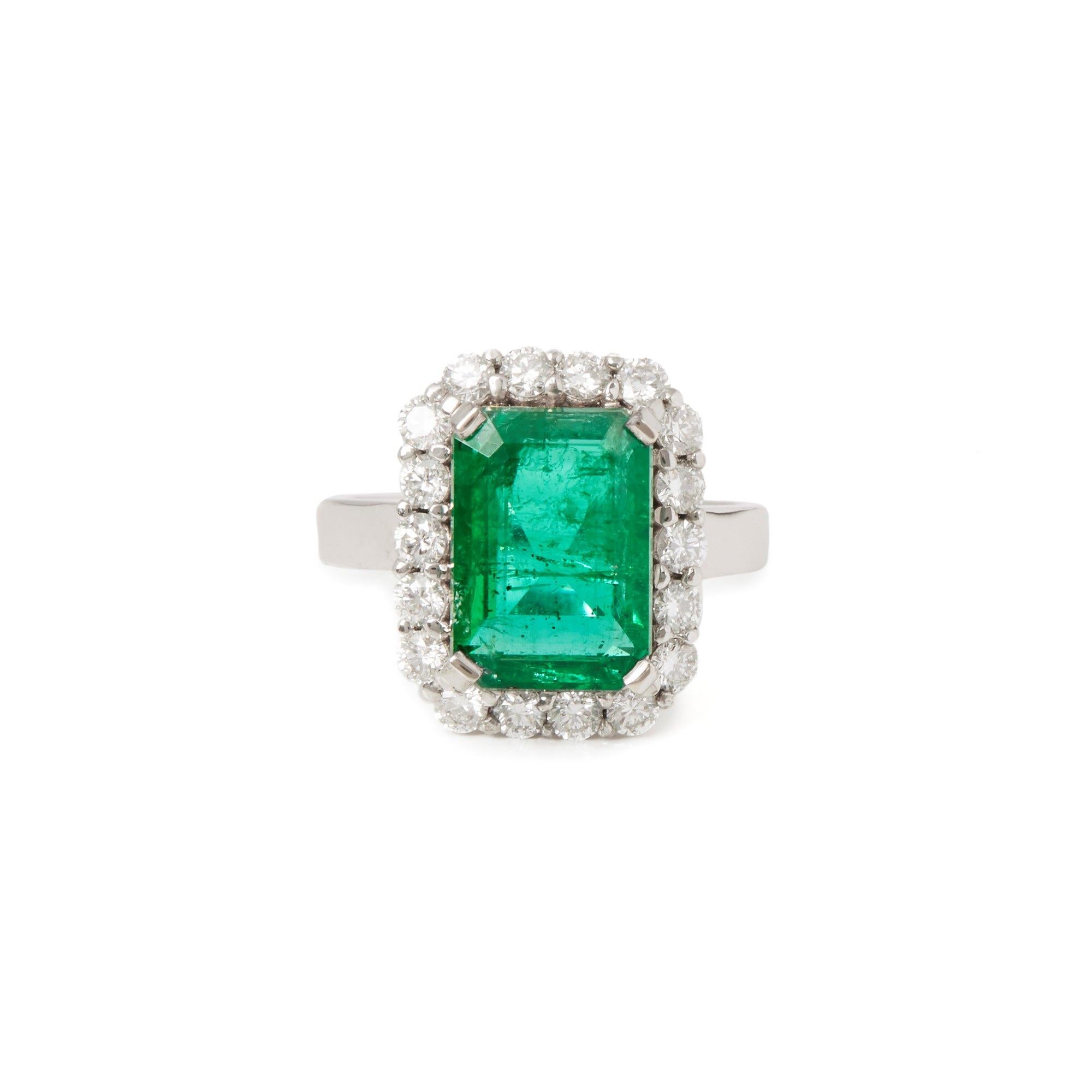 This ring designed by David Jerome is from his private collection and features one Emerald cut Emerald totalling 4.58cts. Set with round brilliant cut Diamonds totalling 0.80cts mounted in an 18k white gold setting. Finger size UK L, EU size 52, USA