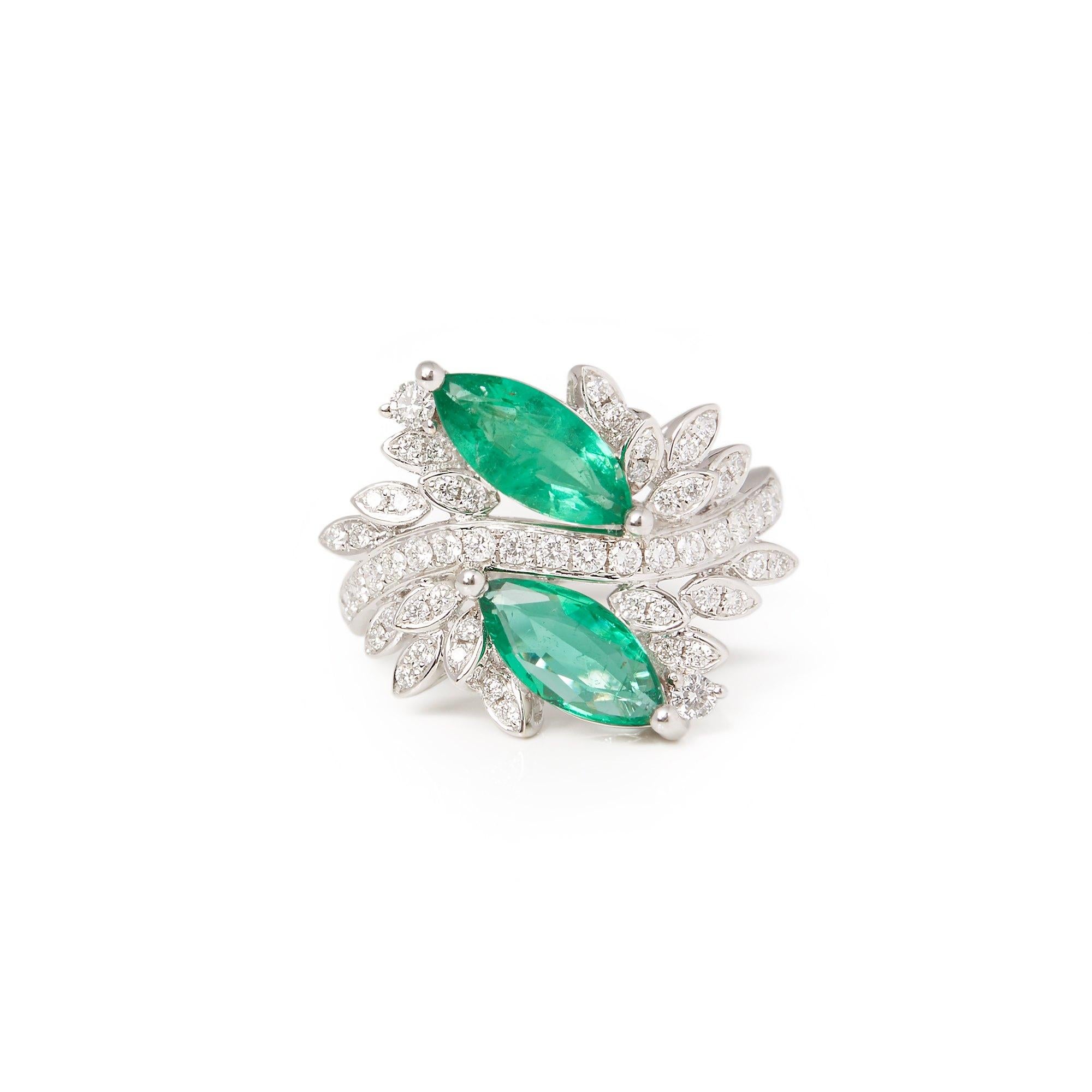 This ring designed by David Jerome is from his private collection and features two marquise cut Emeralds totalling 1.73cts sourced in Zambia set with round brilliant cut Diamonds totalling 0.57cts mounted in an 18k white gold setting. Finger size UK