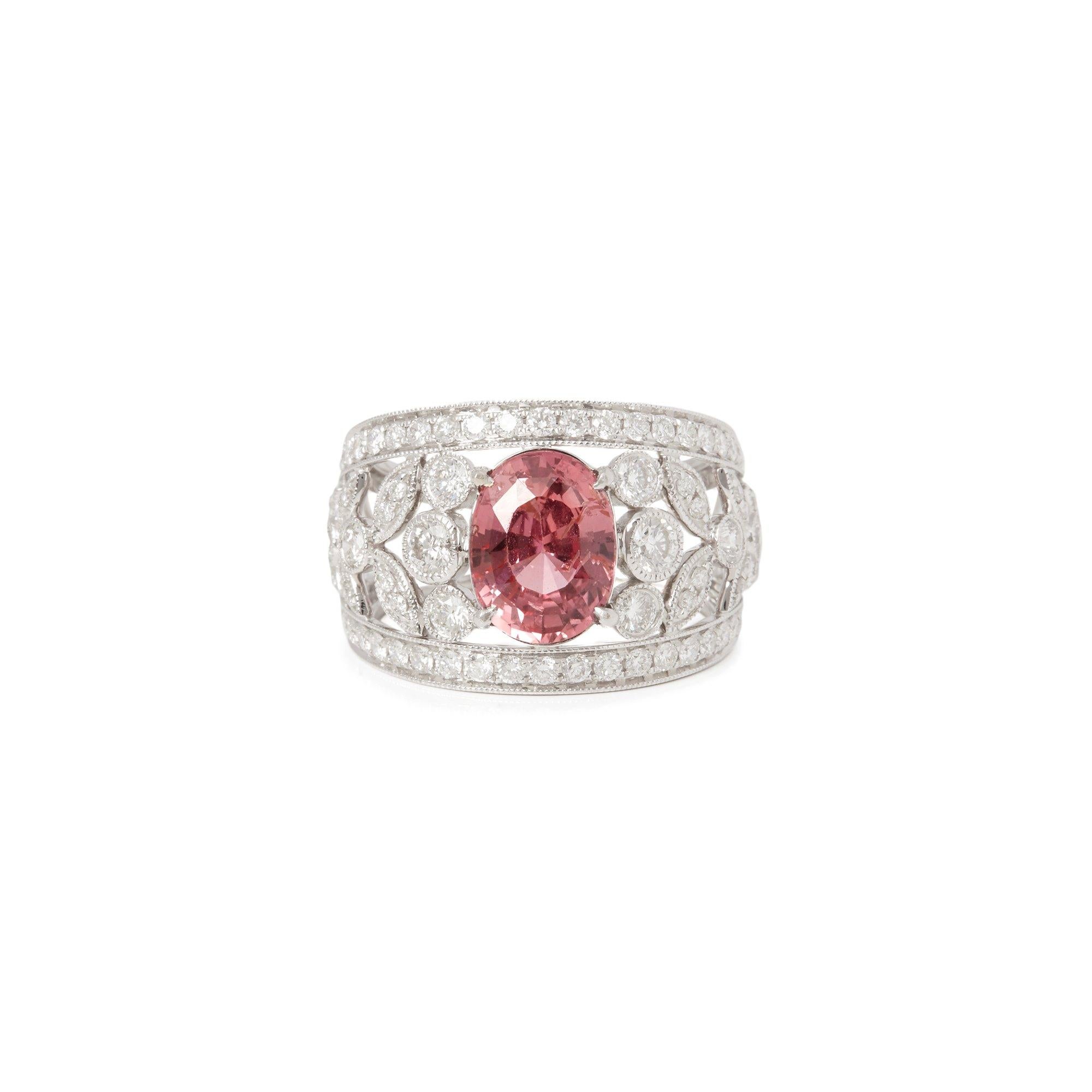 This ring designed by David Jerome is from his private collection and features one oval cut padparadscha Sapphire totalling 3.19cts sourced in Sri Lanka. Set with round brilliant cut Diamonds Totalling 1.56cts mounted in an 18k white gold setting.