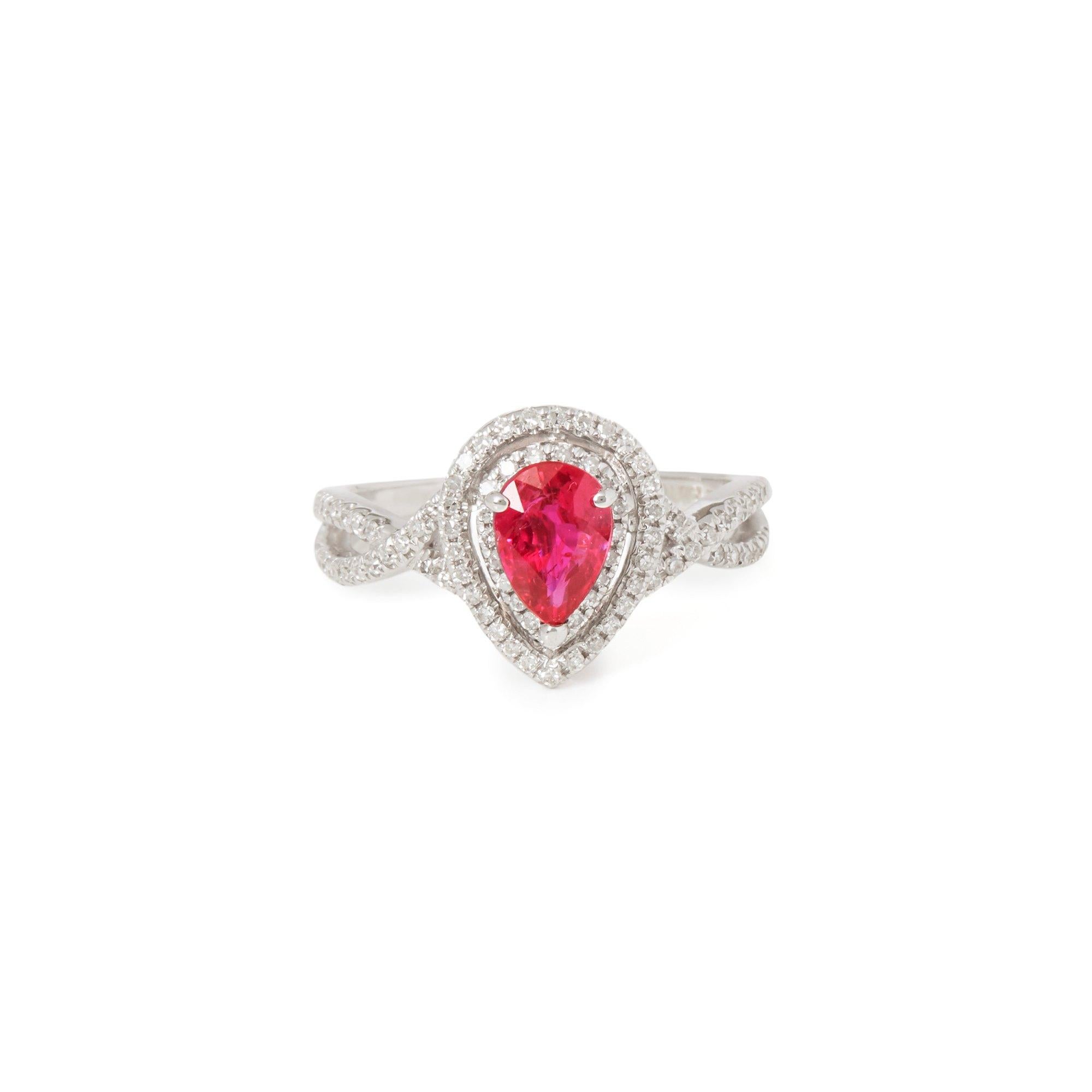 This ring designed by David Jerome is from his private collection and features one pear cut Ruby totalling 1.02cts sourced in Burma. Set with round brilliant cut Diamonds totalling 0.57cts mounted in an 18k white gold setting. UK finger size M 1/2,