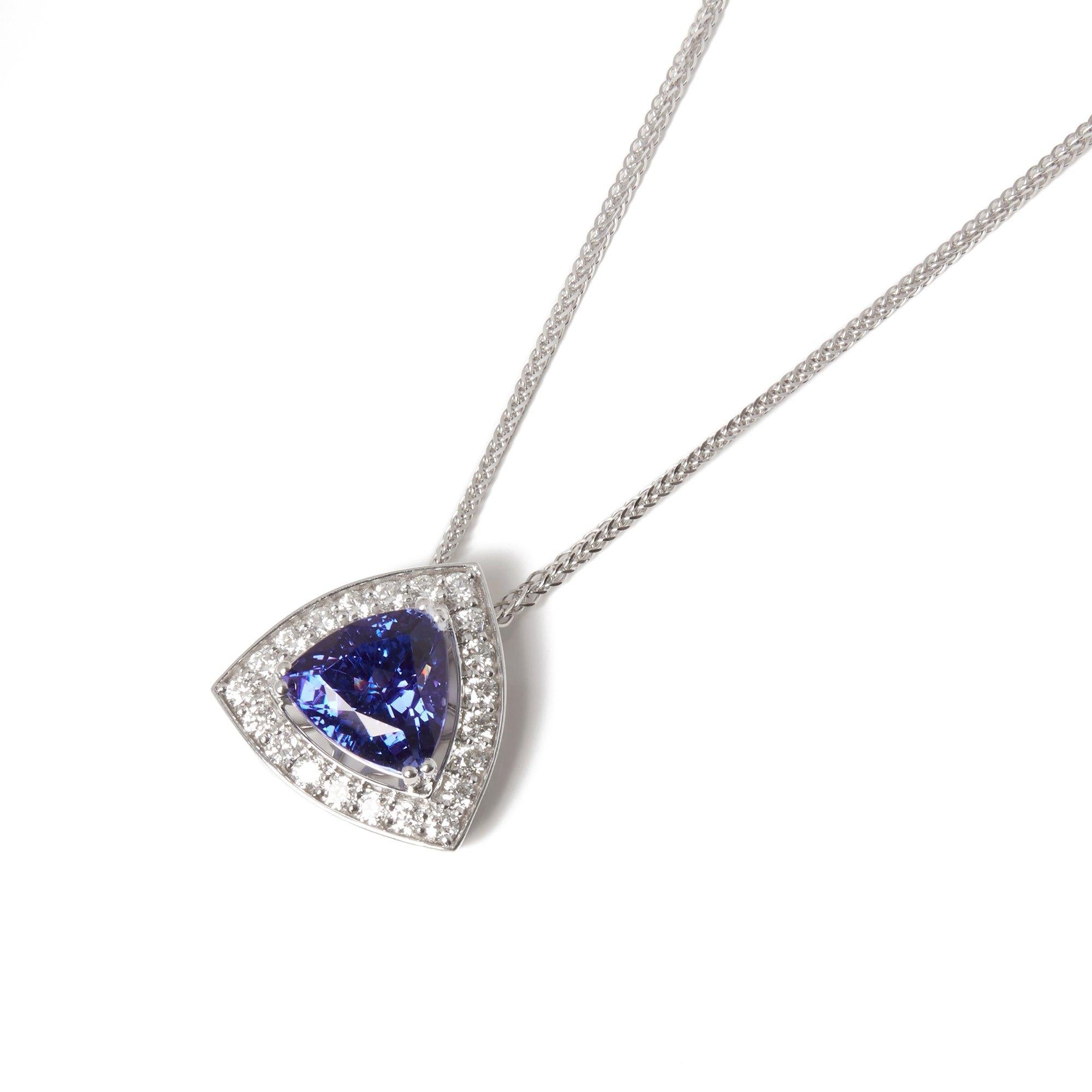 This Pendant Designed by David Jerome is from his Private Collection and features One Trilliant Cut Tanzanite Totalling 13.86cts Sourced in the D Block Mine Tanzania. Set with Round Brilliant Cut Diamonds Totalling 1.72cts Mounted in an 18k White