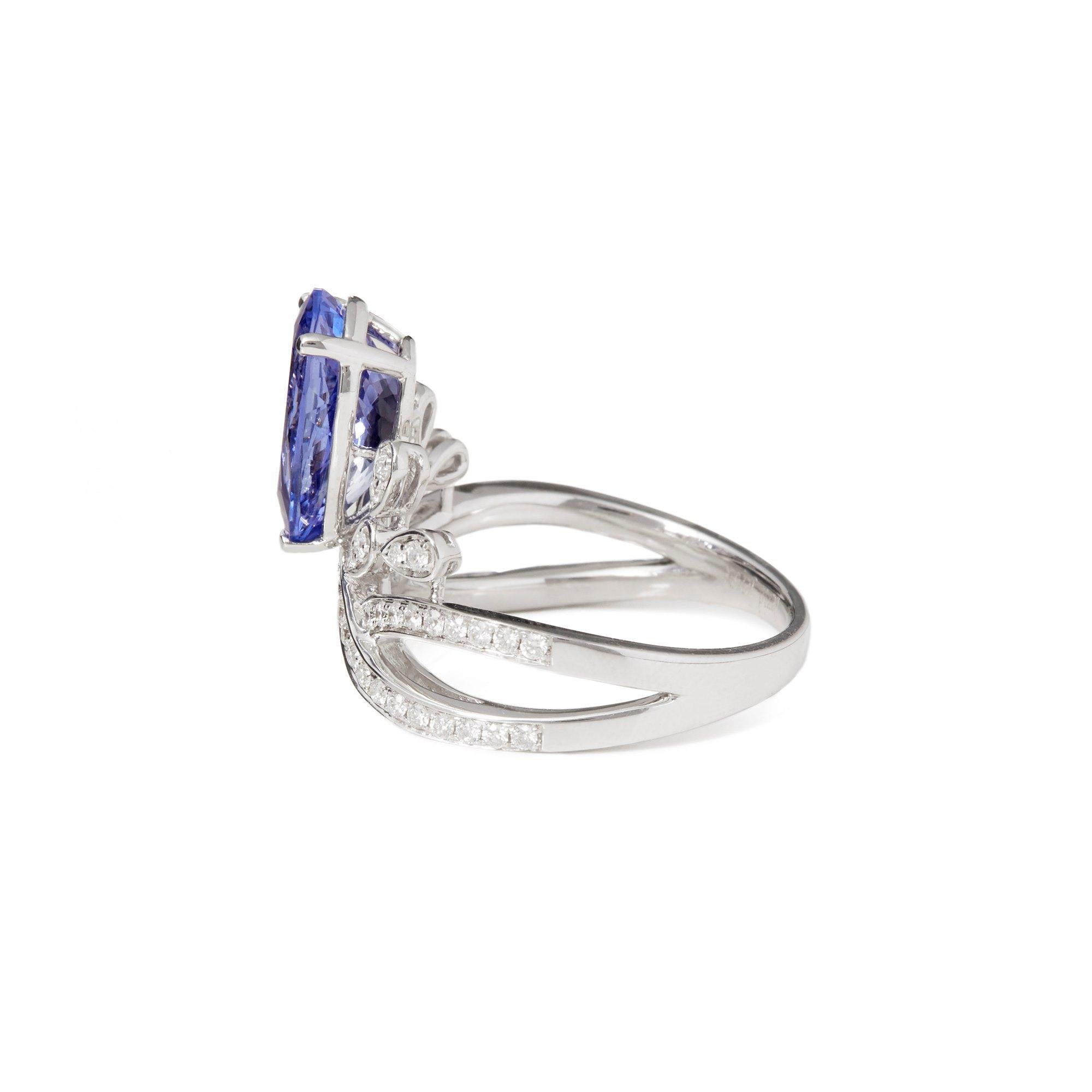 Contemporary Certified 2.7ct Pear Cut Tanzanite and Diamond 18ct gold Ring For Sale