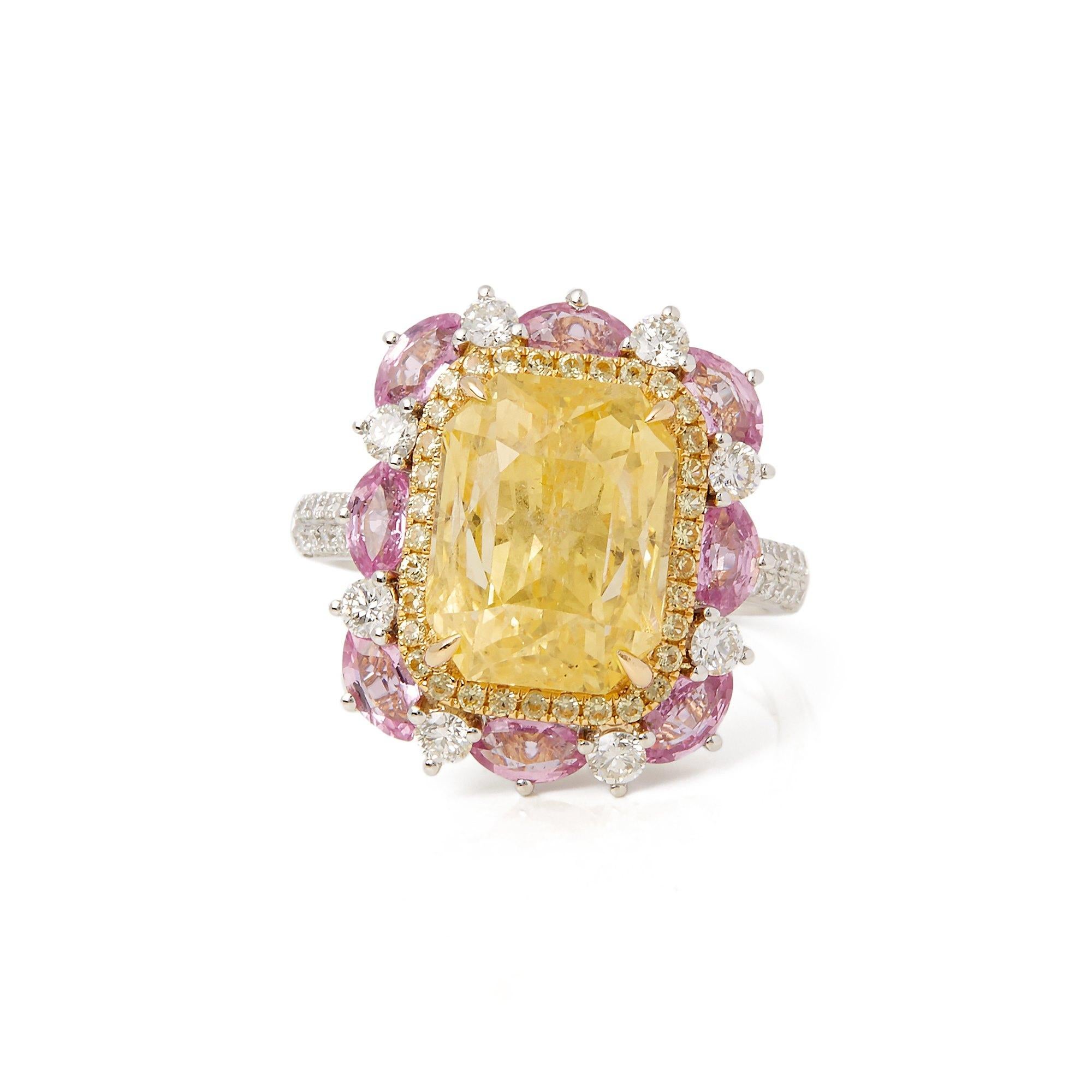 This ring designed by David Jerome is from his private collection and features one cushion cut yellow Sapphire totalling 10.38cts set with round brilliant cut Diamonds and pink Sapphires totalling 2.67cts. Mounted in an 18k white gold setting.