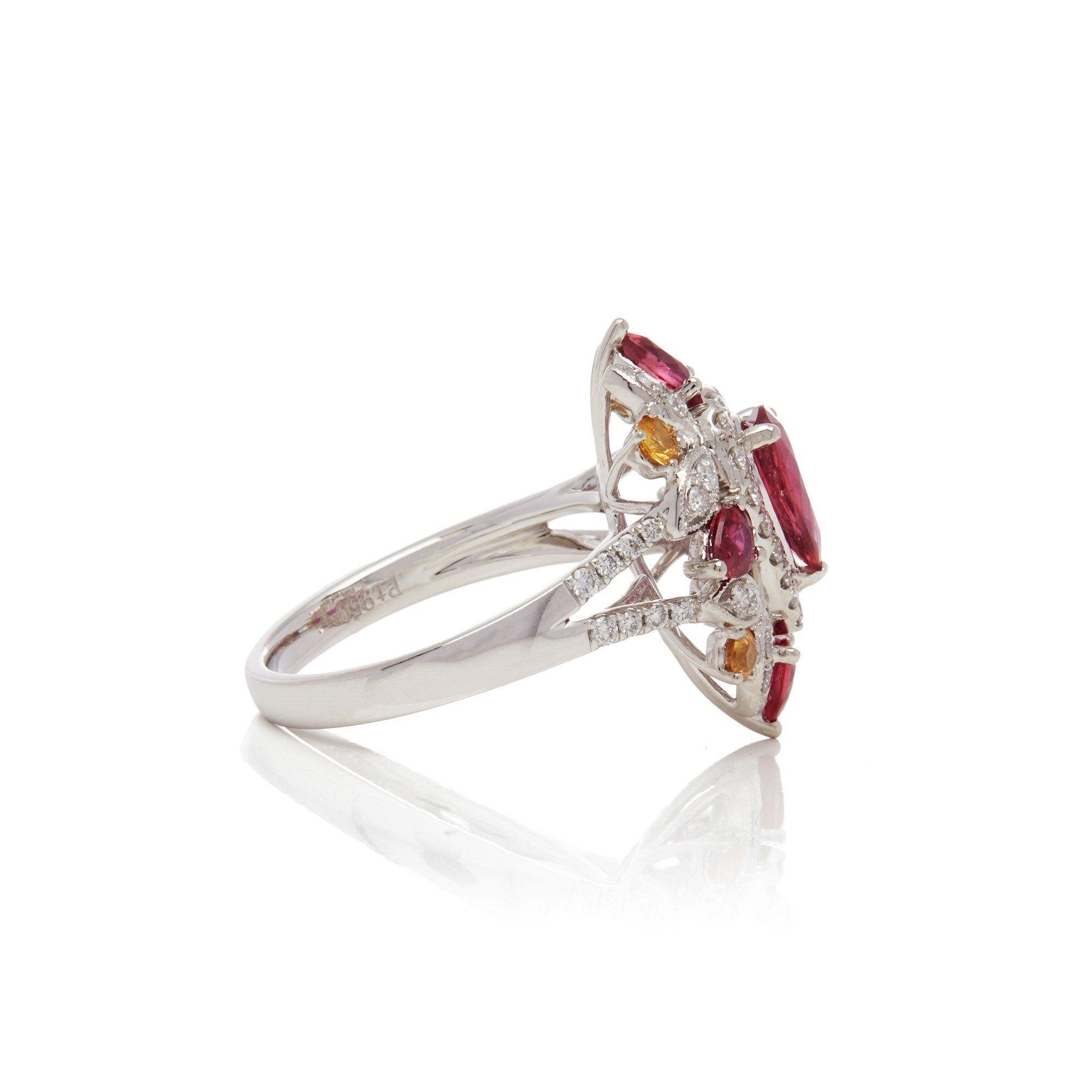 This ring designed by David Jerome is from his private collection and features one pear cut Ruby sourced in Mozambique. Set with a mix of round brilliant cut Diamonds, pear cut Rubies and round cut yellow Sapphires totalling 1.84cts combined.
