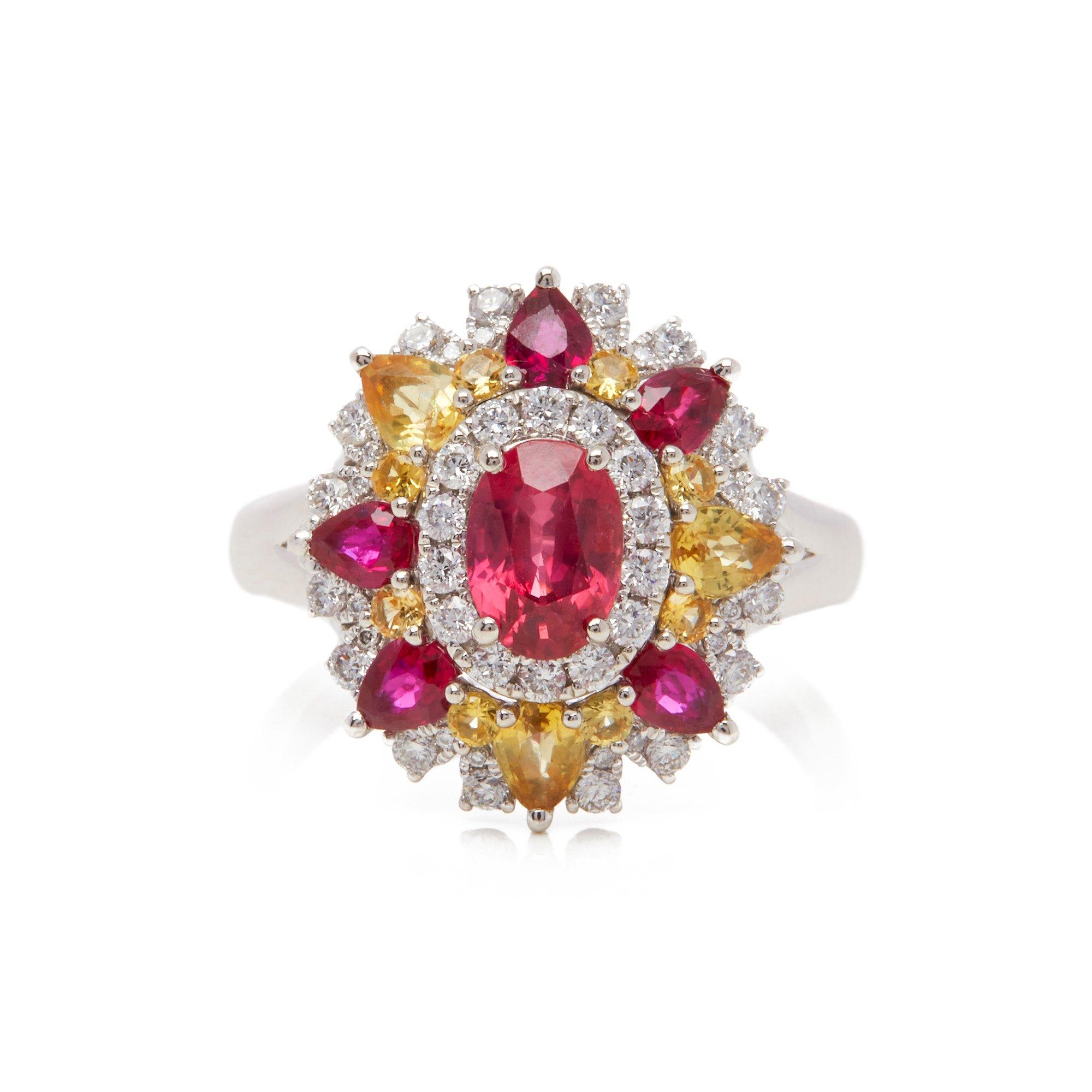 This ring designed by David Jerome is from his private collection and features one oval cut Ruby sourced in Mozambique totalling 1.07cts. Set with a mix of round brilliant cut Diamonds, Rubies and yellow Sapphires totalling 2.02cts combined. Mounted
