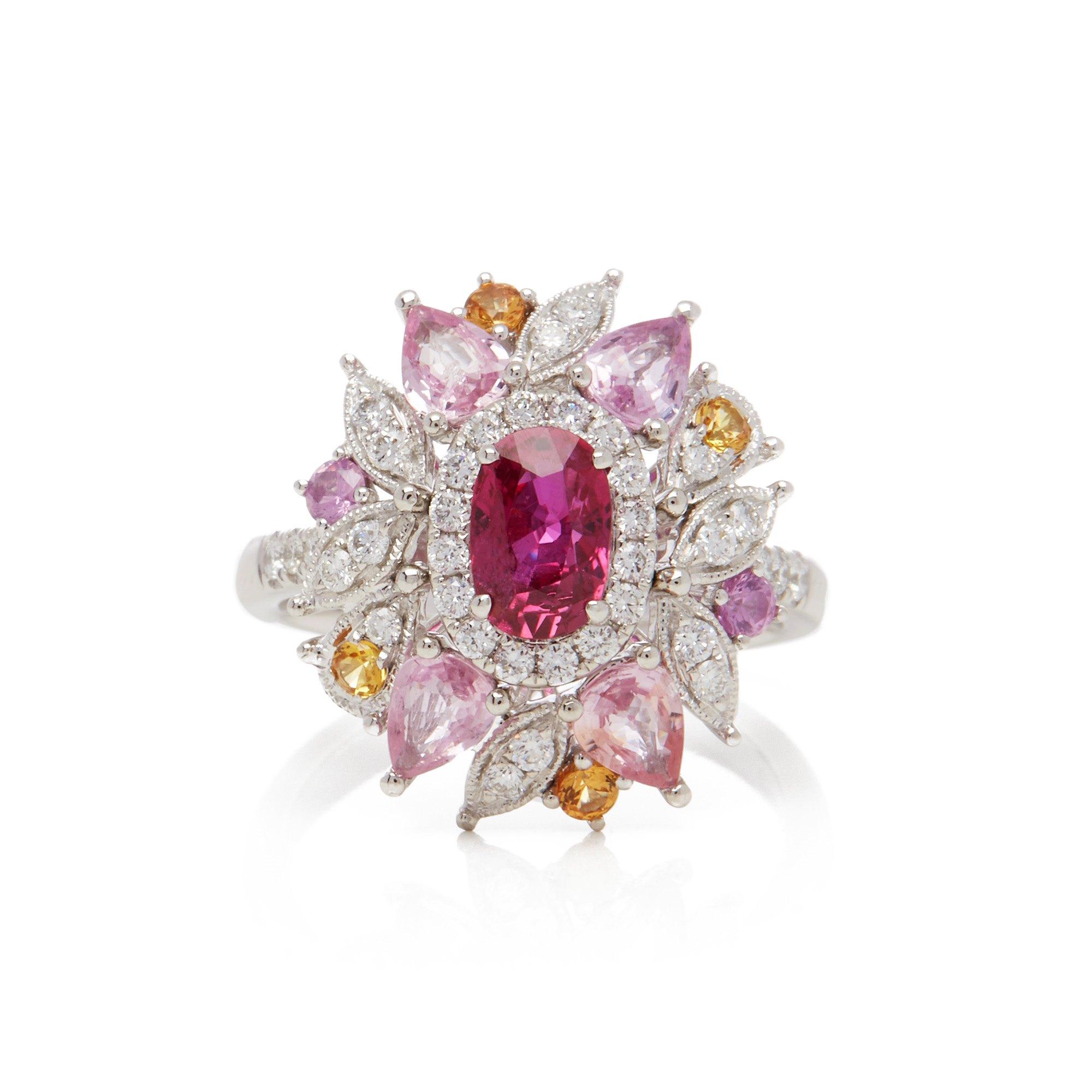 This ring designed by David Jerome is from his private collection and features one oval cut Ruby sourced in Mozambique Totalling 1.08cts. Set with a mix of round brilliant cut Diamonds, pink and yellow Sapphires totalling 1.94cts combined. Mounted