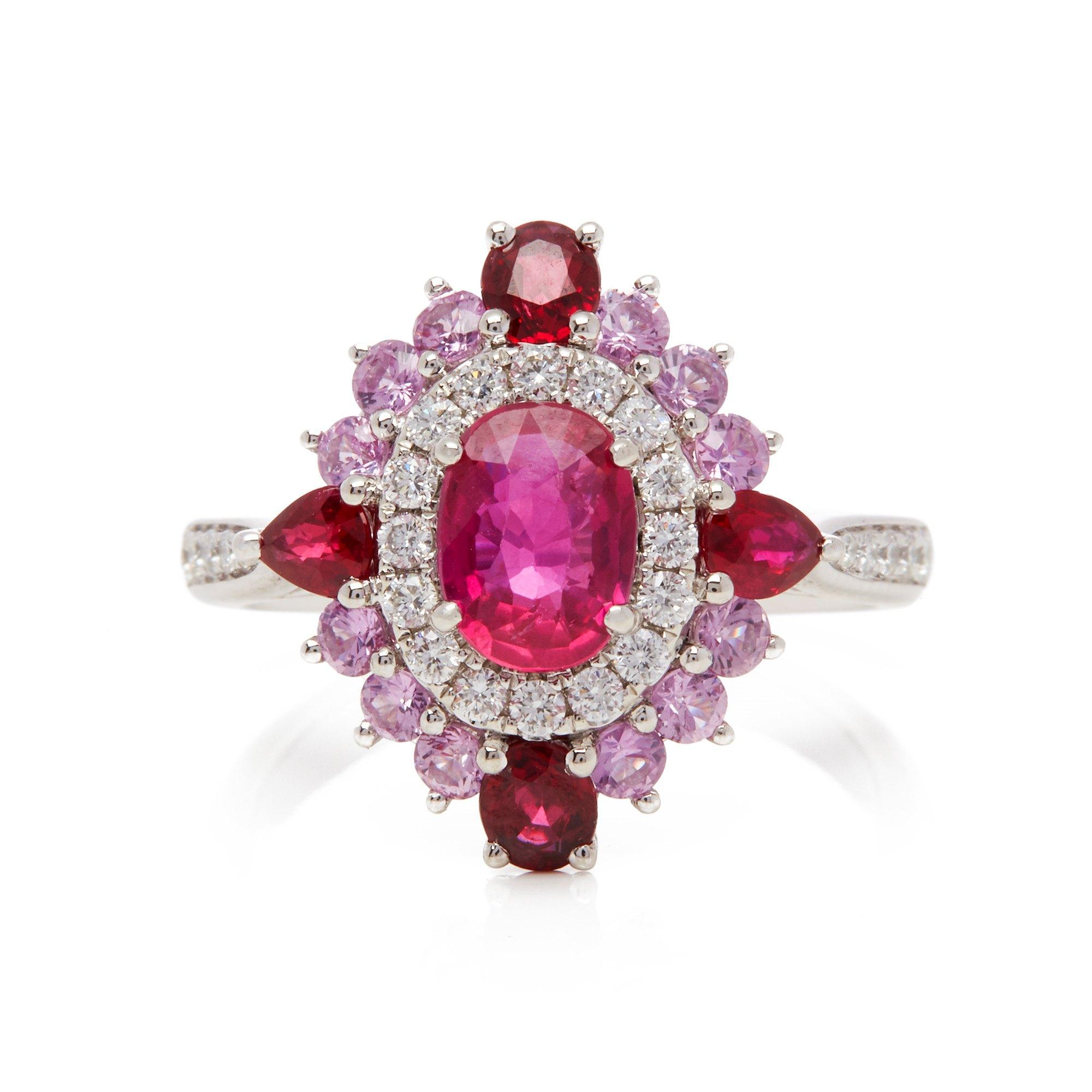 This ring designed by David Jerome is from his private collection and features one oval cut Ruby sourced in Mozambique totalling 1.11cts. Set with a mix of round brilliant cut Diamonds, Rubies and pink Sapphires totalling 1.85cts combined. Mounted