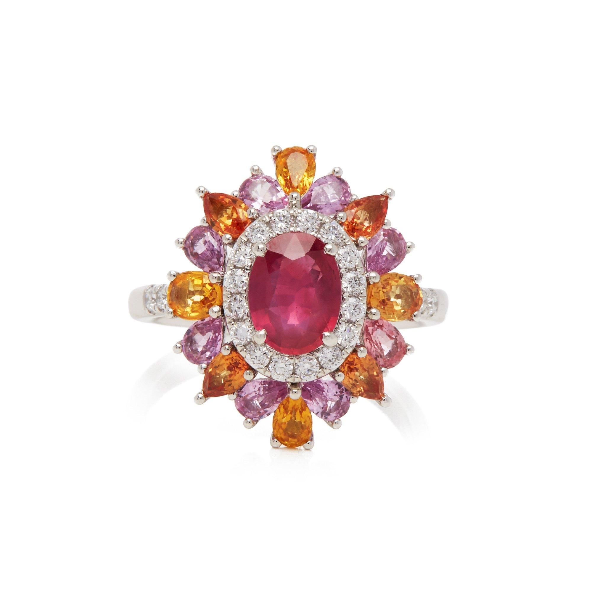 This ring designed by David Jerome is from his private collection and features one oval cut Ruby sourced in Mozambique totalling 1.19cts. Set with a mix of round brilliant cut Diamonds, pink and yellow Sapphires totalling 2.66cts combined. Mounted
