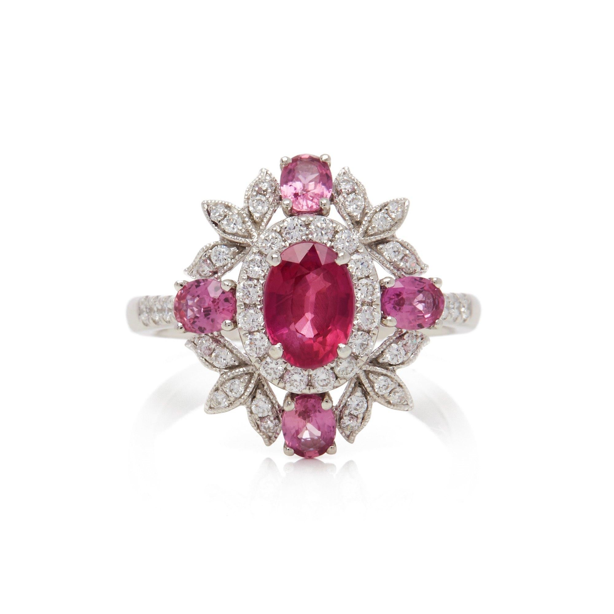 This ring designed by David Jerome is from his private collection and features one oval cut Ruby sourced in Mozambique totalling 1.19cts. Set with a mix of round brilliant cut Diamonds and pink Sapphires totalling 1.60cts combined. Mounted in