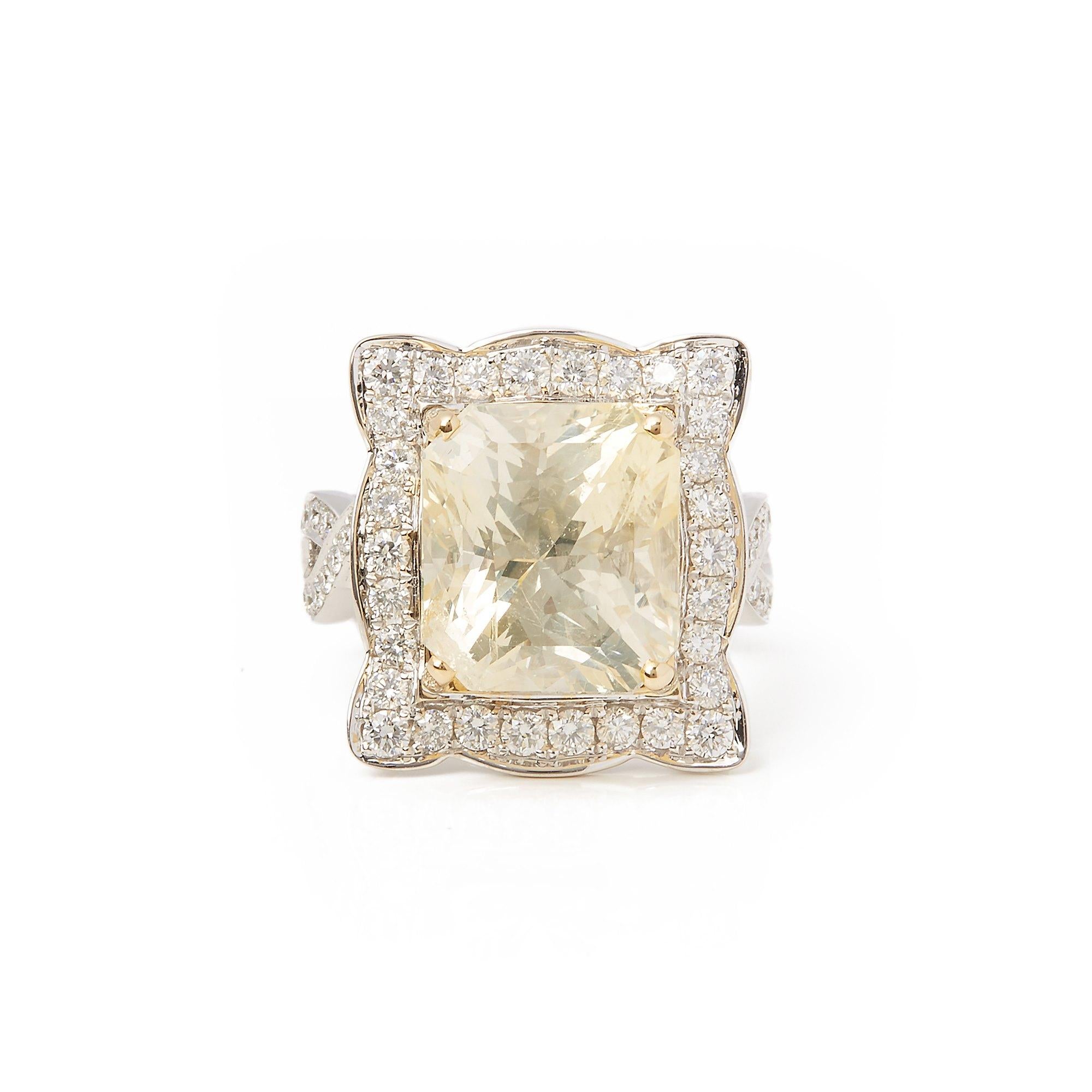 This ring designed by David Jerome is from his private collection and features one cushion cut yellow Sapphire sourced in Sri Lanka. Totalling 12.19cts set with round brilliant cut Diamonds totalling 1.24cts. Mounted in an 18k white gold setting.