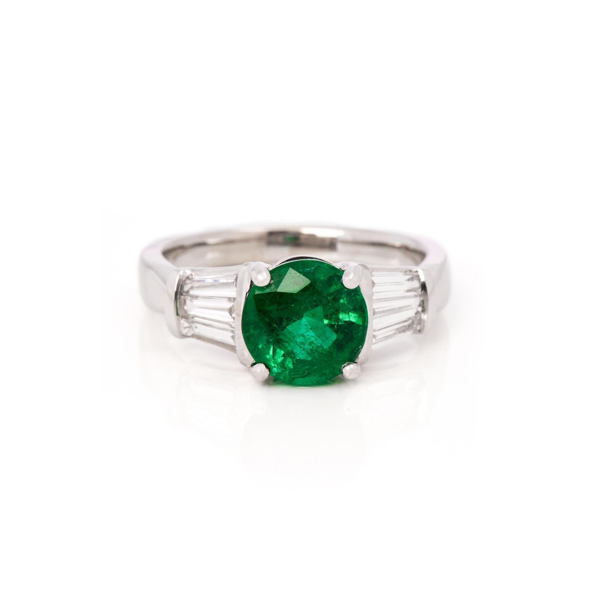 This ring is from the private collection of gemstone jewellery individually designed by David Jerome. It features a round cut emerald set with diamonds. Accompanied by an IGR gem certificate. UK ring size L. EU ring size 51. US ring size 6. 