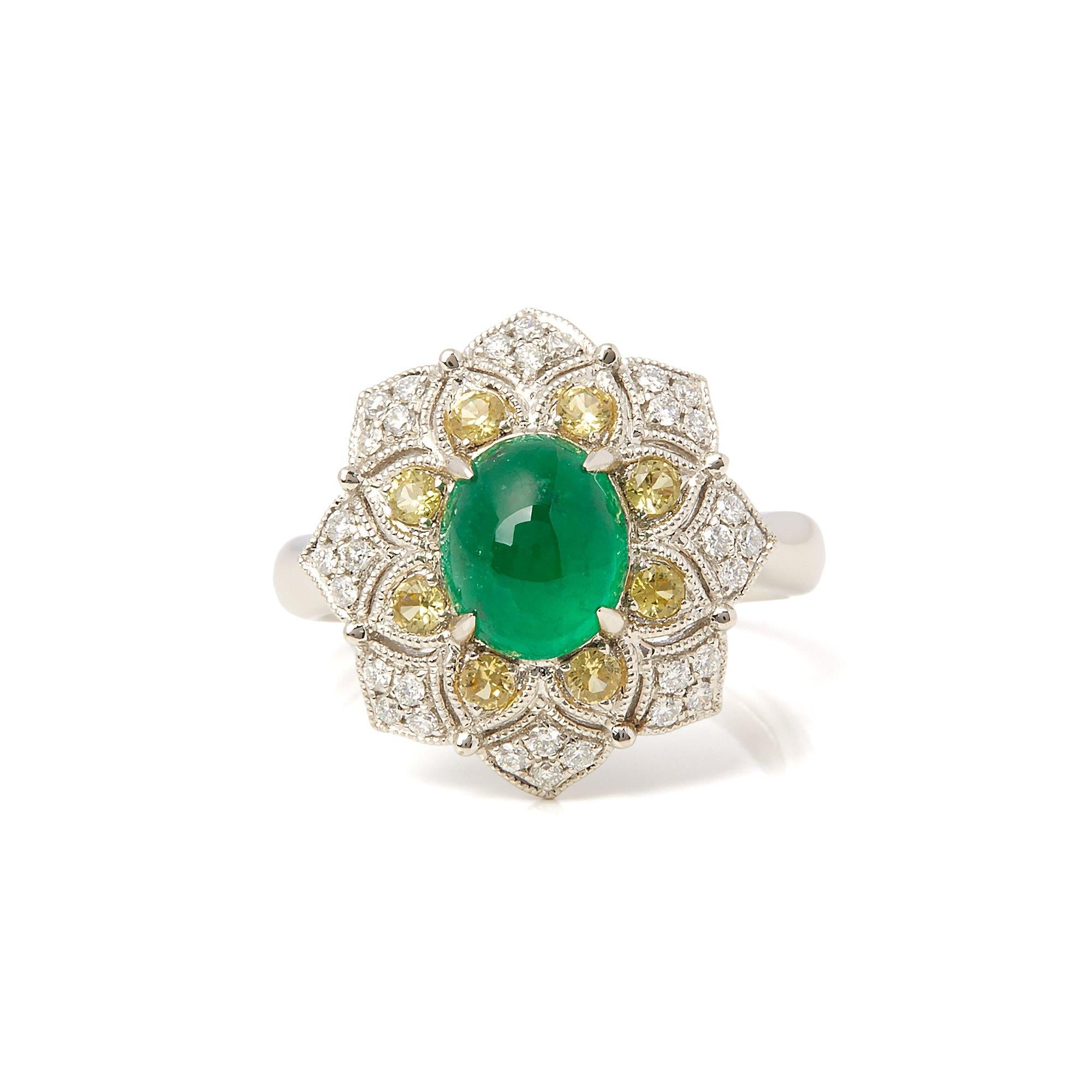 This ring designed by David Jerome is from his private collection and features one cabochon cut Emerald sourced in the chivor mine in Columbia. Totalling 2.16cts set with round brilliant cut Diamonds and yellow Sapphires totalling 0.32cts. Mounted