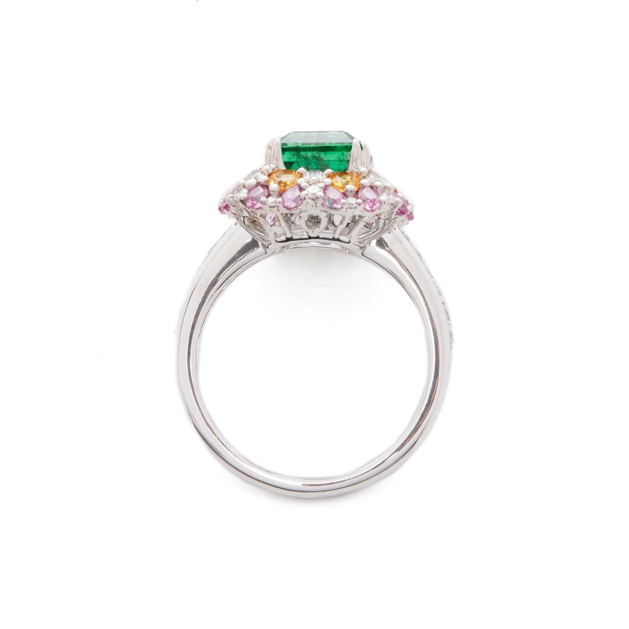 Contemporary Platinum Emerald, Diamond and Mixed Sapphire Cluster Ring For Sale