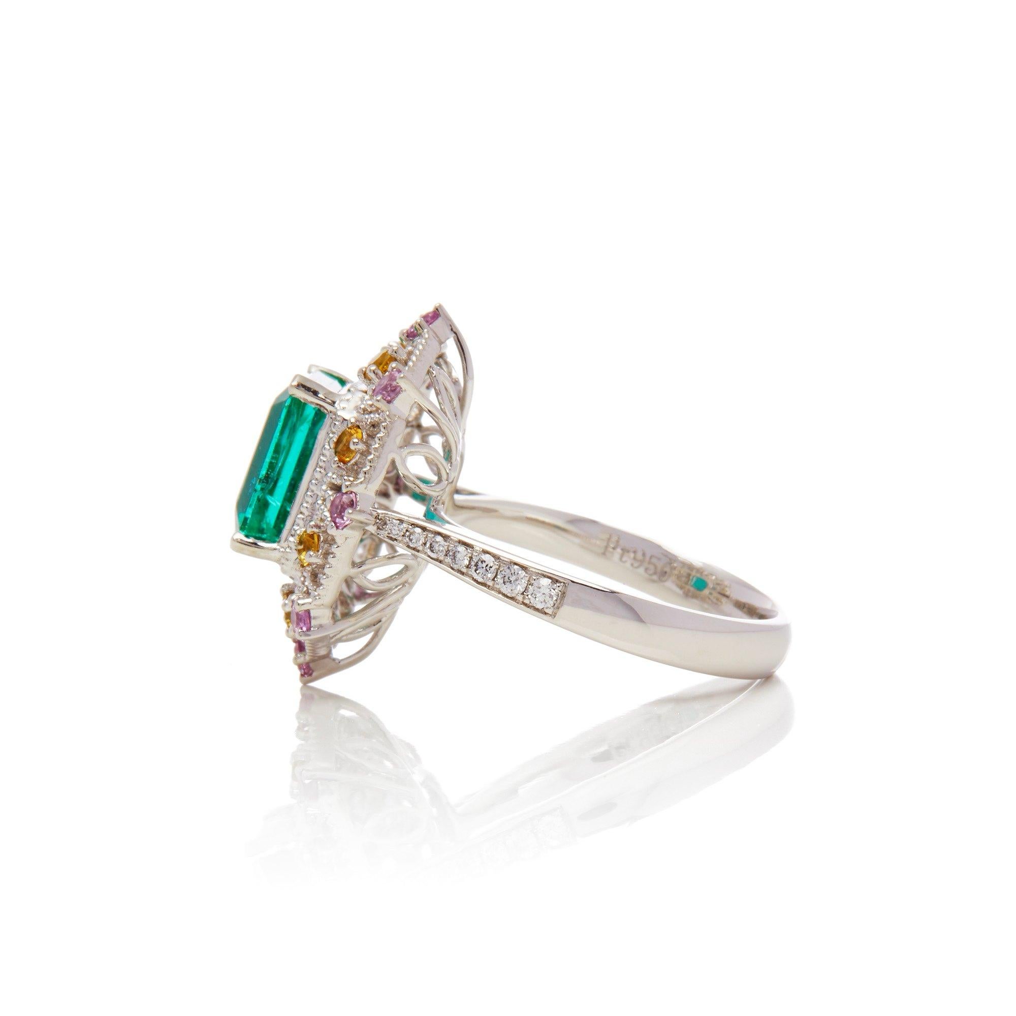 This ring designed by David Jerome is from his private collection and features one Emerald cut Emerald sourced in the chivor mine in Columbia totalling 3.03cts. Set with a mix of round brilliant cut Diamonds, pink and yellow Sapphires totalling