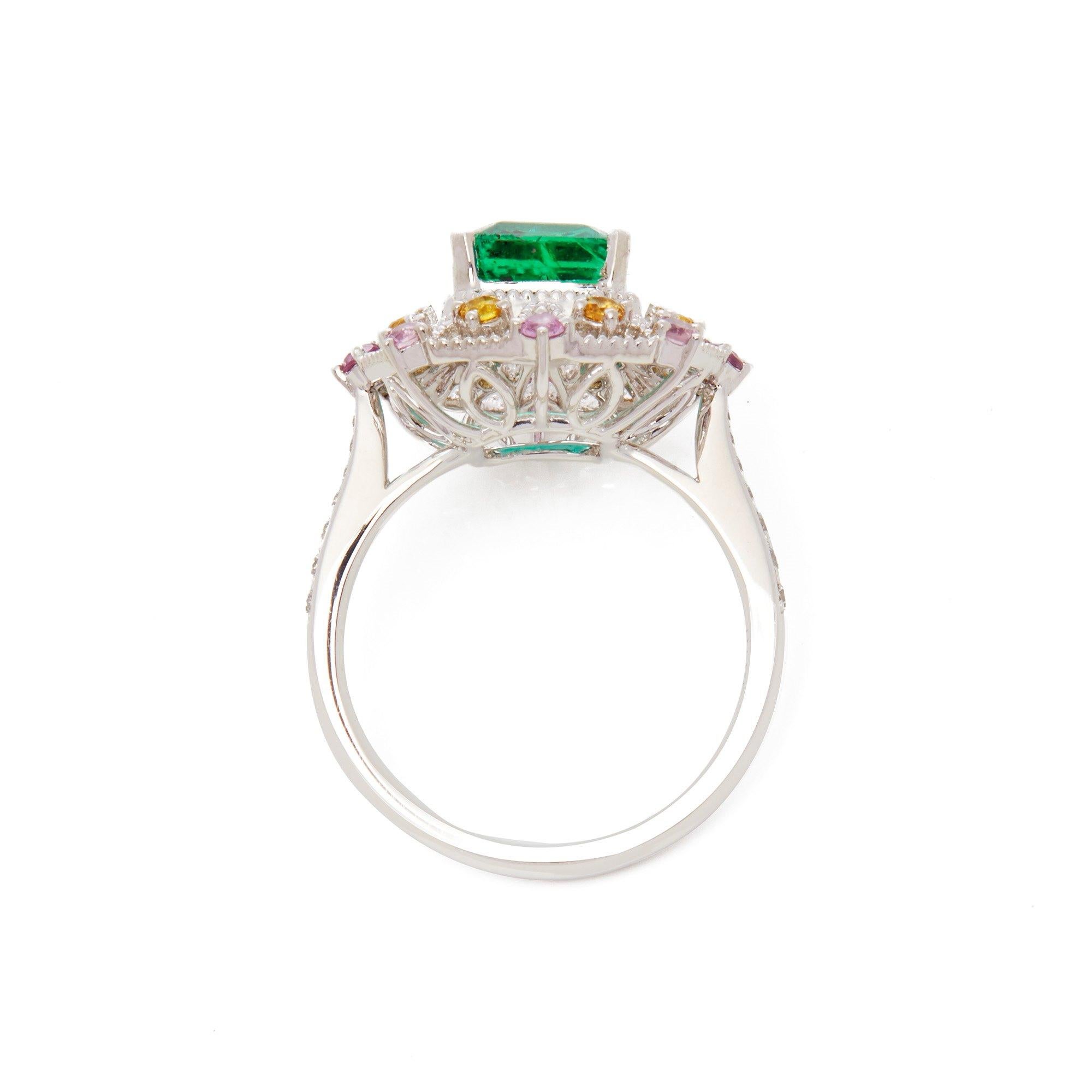 Platinum Emerald, Diamond and Mixed Sapphire Cluster Ring In New Condition For Sale In Bishop's Stortford, Hertfordshire