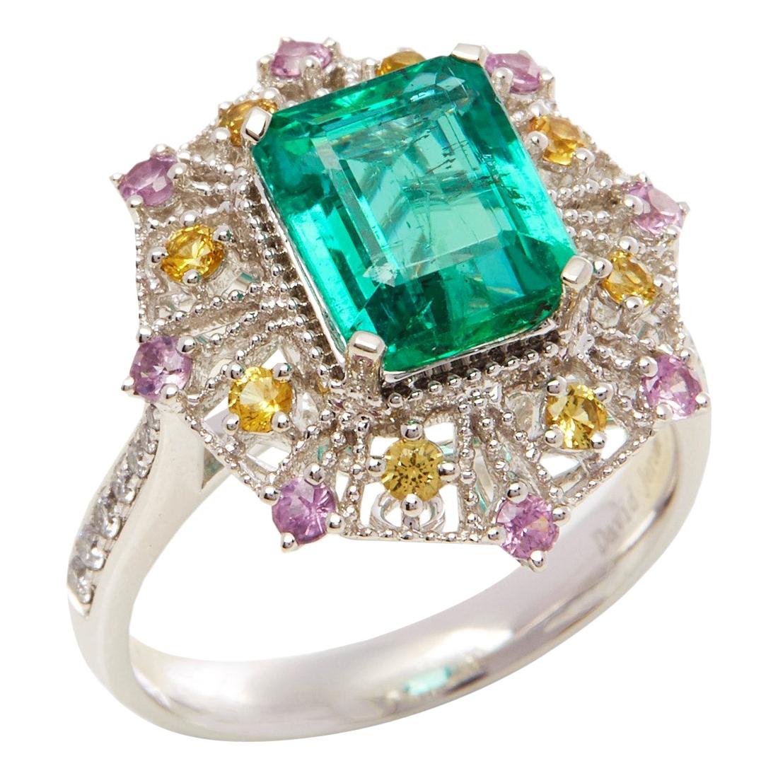 Platinum Emerald, Diamond and Mixed Sapphire Cluster Ring For Sale
