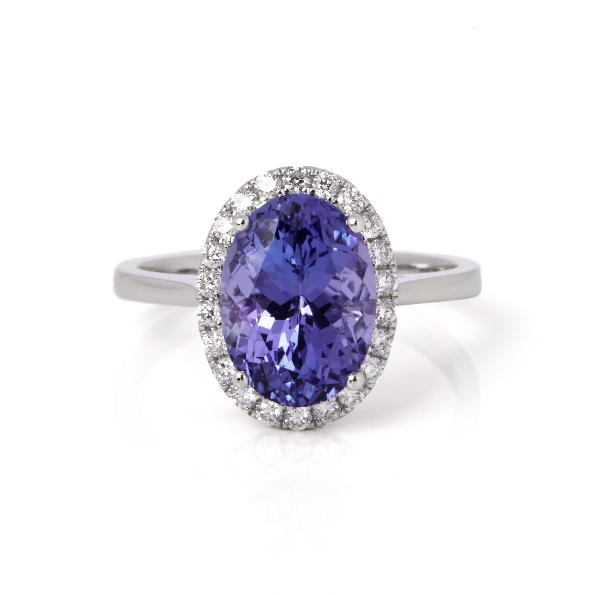 This ring is from the private collection of gemstone jewellery individually designed by David Jerome. It features an oval cut tanzanite set with diamonds. Accompanied by an IGITL gem certificate. UK ring size N. EU ring size 54. US ring size 7. 