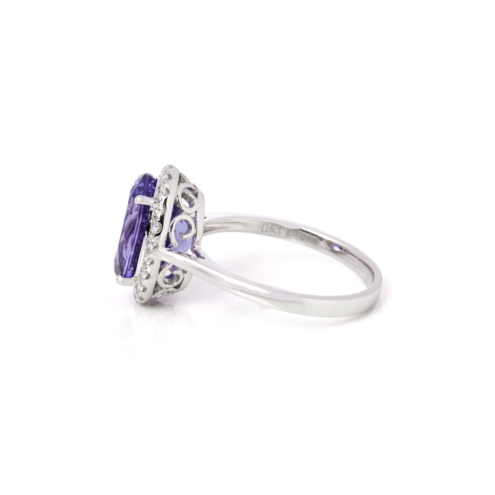 Contemporary David Jerome Certified 4.23ct Oval Cut Tanzanite and Diamond Ring For Sale