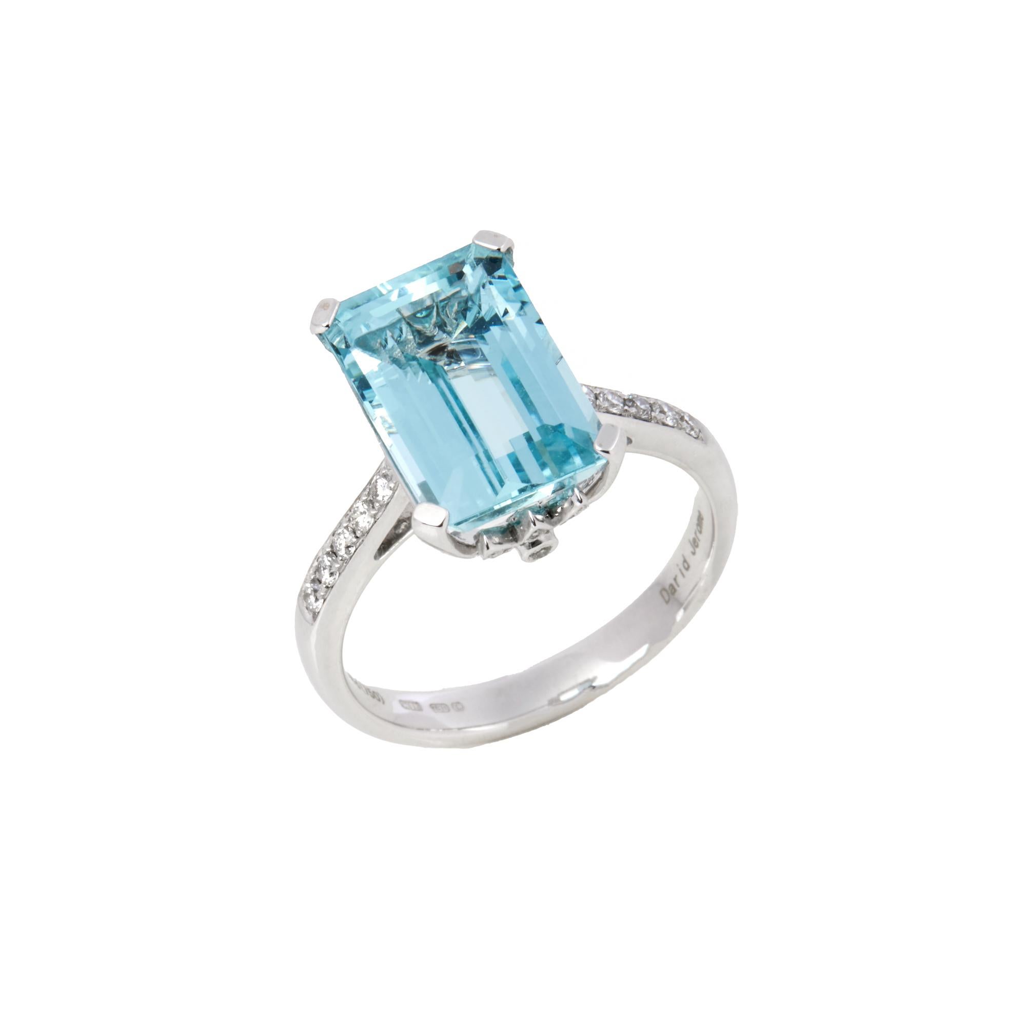 This ring is from the private collection of gemstone jewellery individually designed by David Jerome. It features an emerald cut aquamarine set with diamonds. Accompanied by an IGITL gem certificate. UK ring size N. EU ring size 54. US ring size 7. 