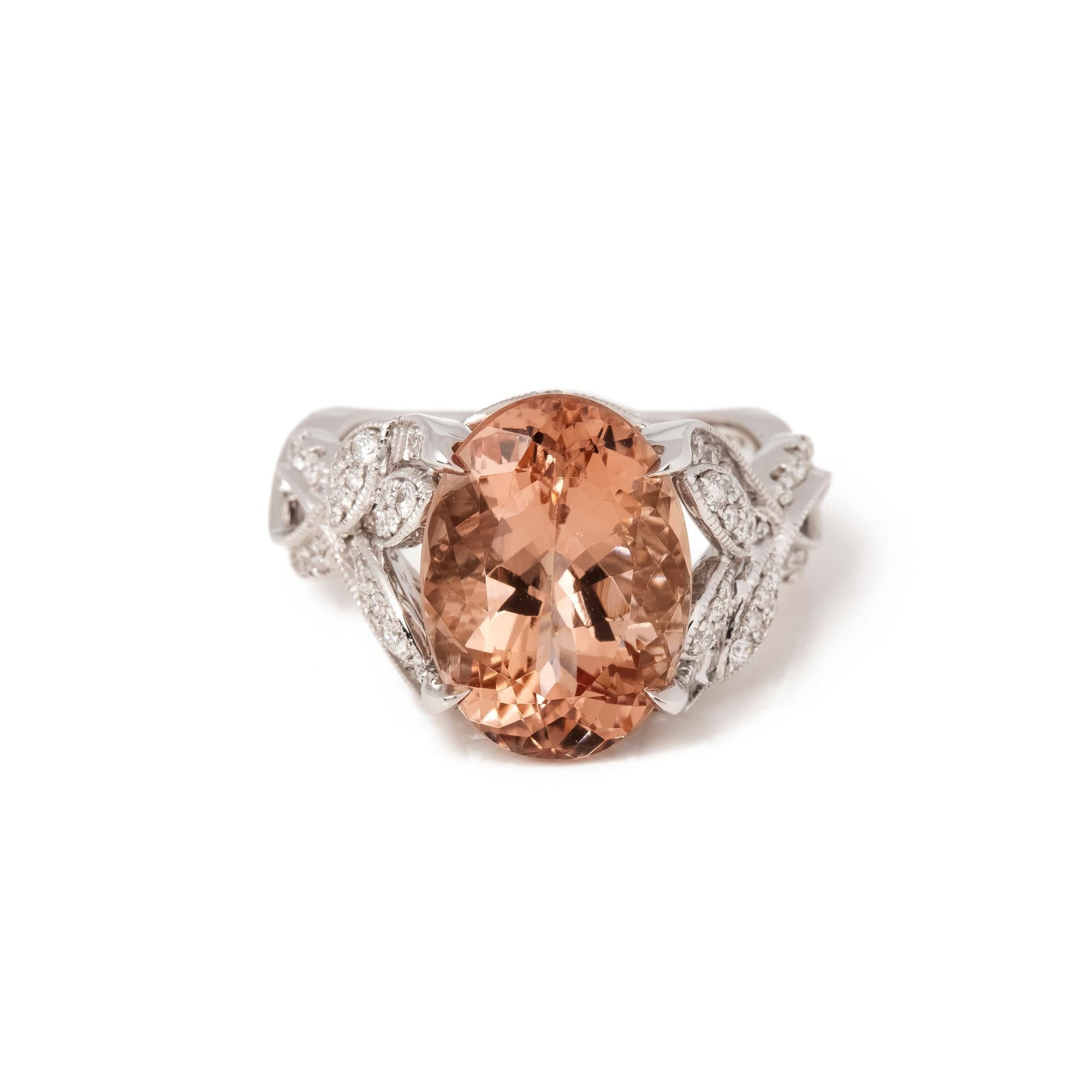 This ring is from the private collection of gemstone jewellery individually designed by David Jerome. It features an oval cut morganite set with diamonds. Accompanied by an IGITL gem certificate. UK ring size N. EU ring size 54. US ring size 7. 
