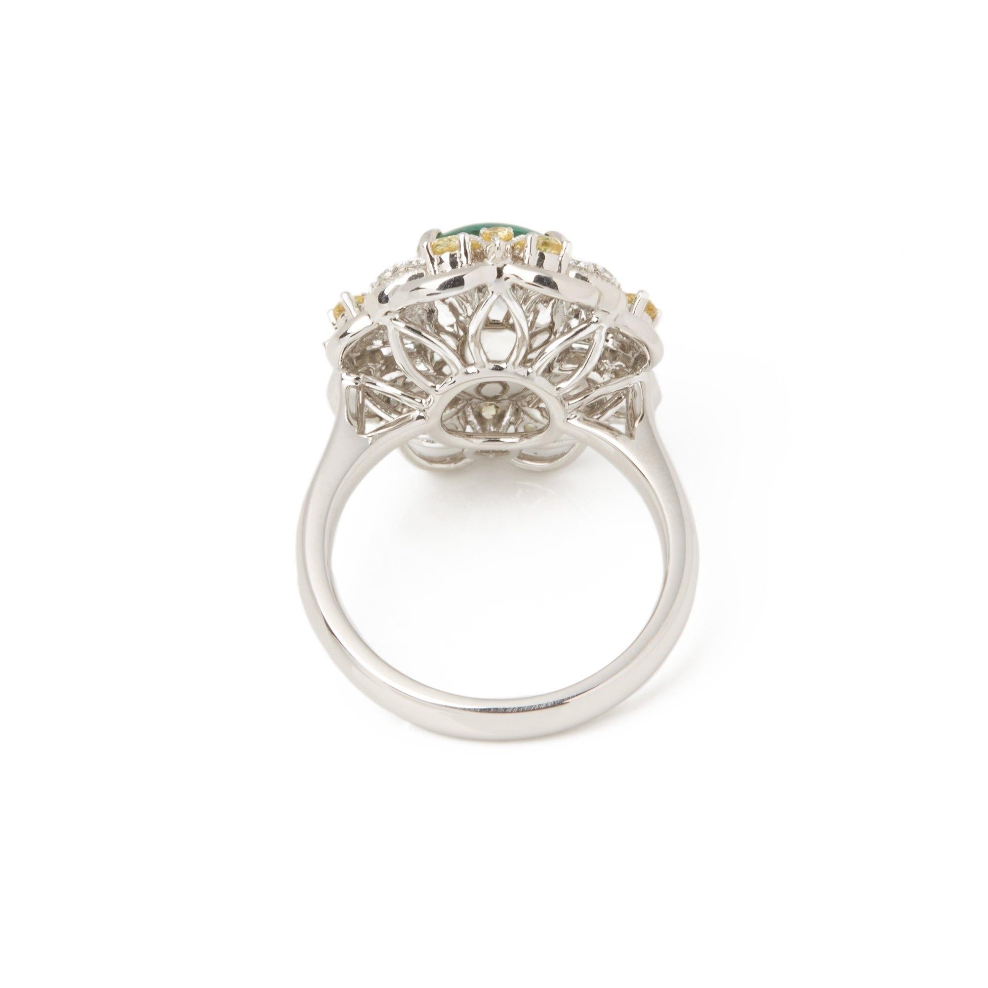Platinum Emerald, Diamond and yellow Sapphire Cluster Ring In New Condition For Sale In Bishop's Stortford, Hertfordshire