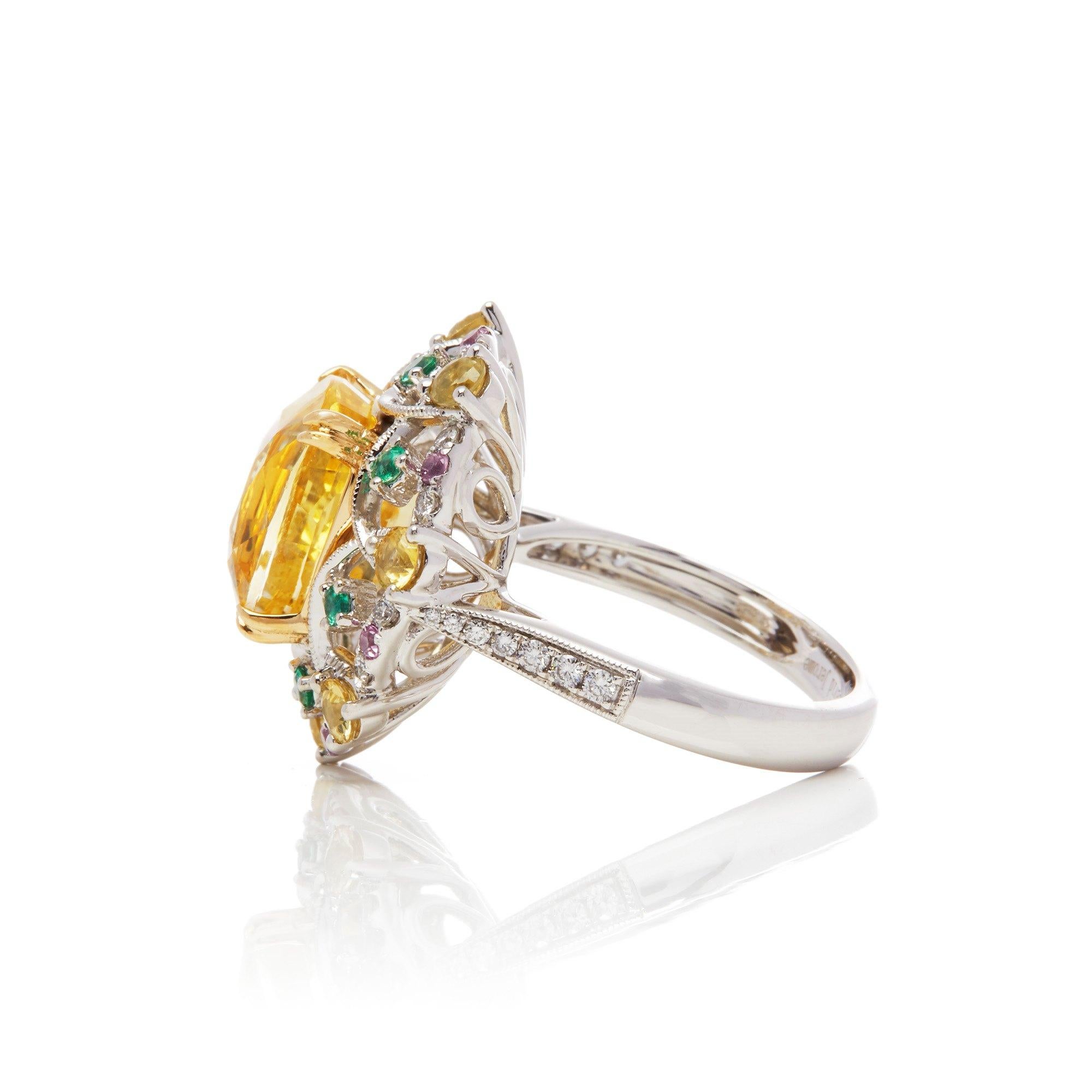 This ring designed by David Jerome is from his private collection and features one cushion cut yellow Sapphire sourced in Sri Lanka totalling 8.60cts. Set with a mix of round brilliant cut Diamonds, Emeralds and yellow Sapphires totalling 2.48cts