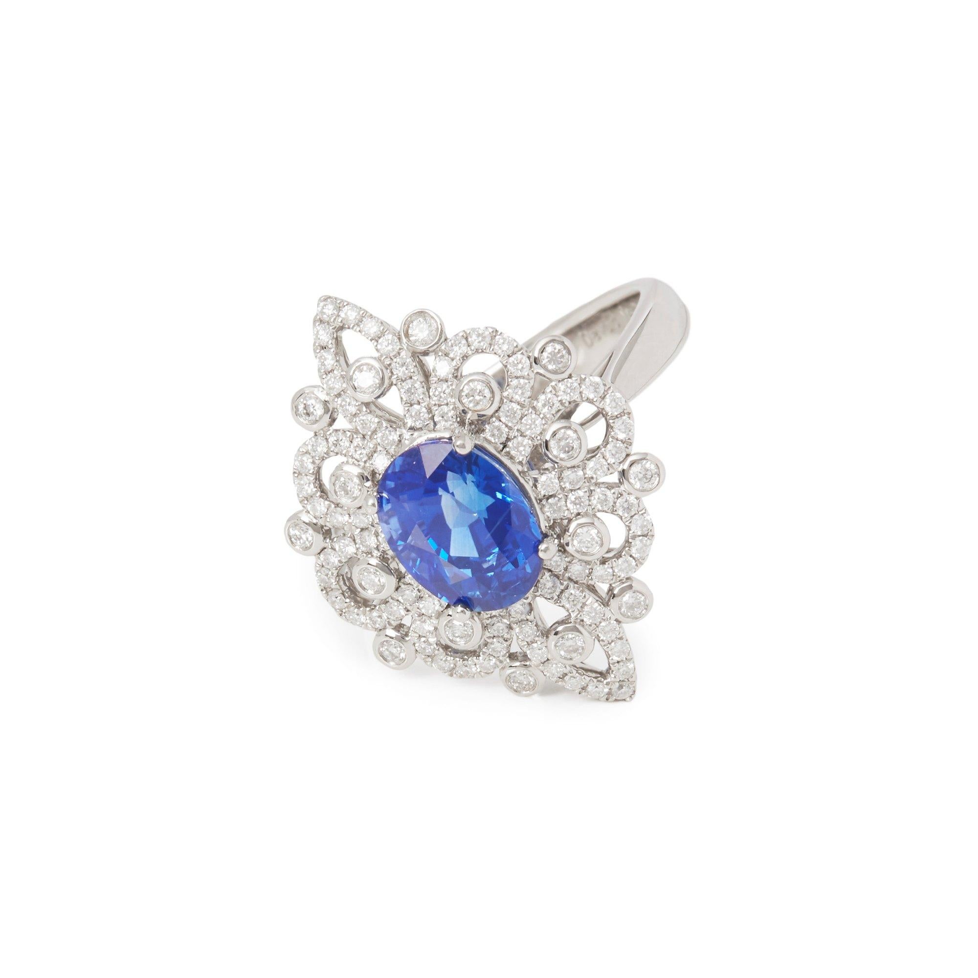 This ring designed by David Jerome is from his private collection and features one oval cut Sapphire totalling 2.20cts sourced in Sri Lanka. Set with round brilliant cut Diamonds totalling 0.60cts mounted in a platinum setting. Finger size UK N, EU