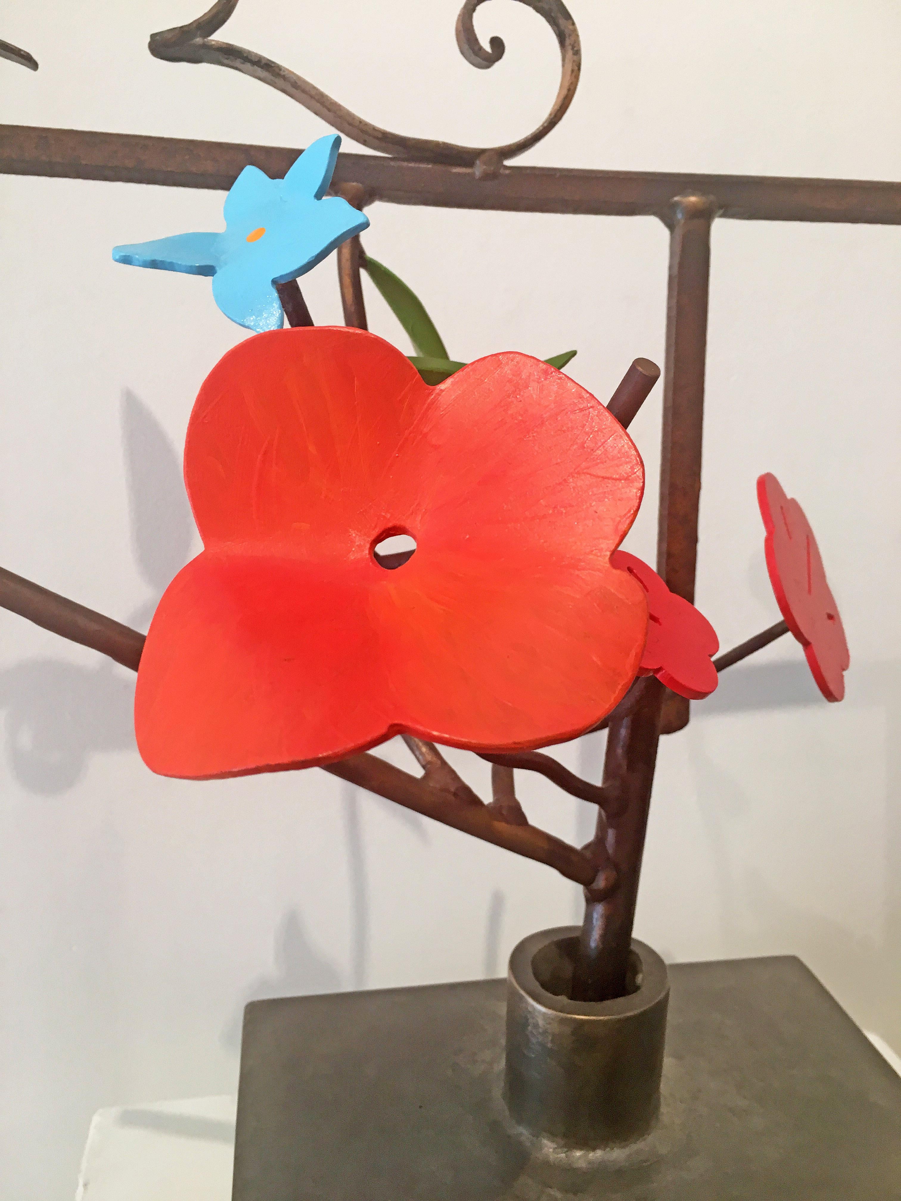 'Diebenkorn Summer 2' by David Kimball Anderson, 2017. Bronze, steel, and paint, 22.5 x 20.25 x 15 in. This sculpture features a square vase cast in bronze and finished in varying patinas of light and dark gray. The flowers are in bright colors of