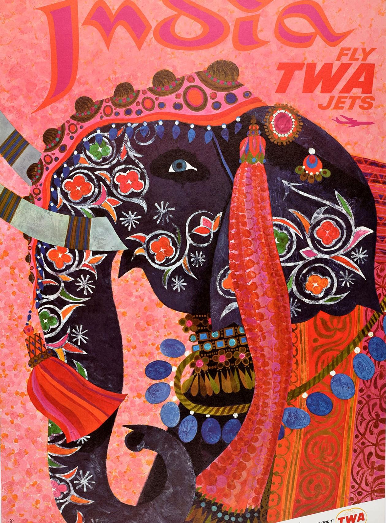 Original vintage travel poster for India Fly TWA Jets Up Up and Away featuring a colourful design by the American artist David Klein (1918-2005) depicting a decorative Indian elephant with smiling eyes in front of a pink shaded background, an image