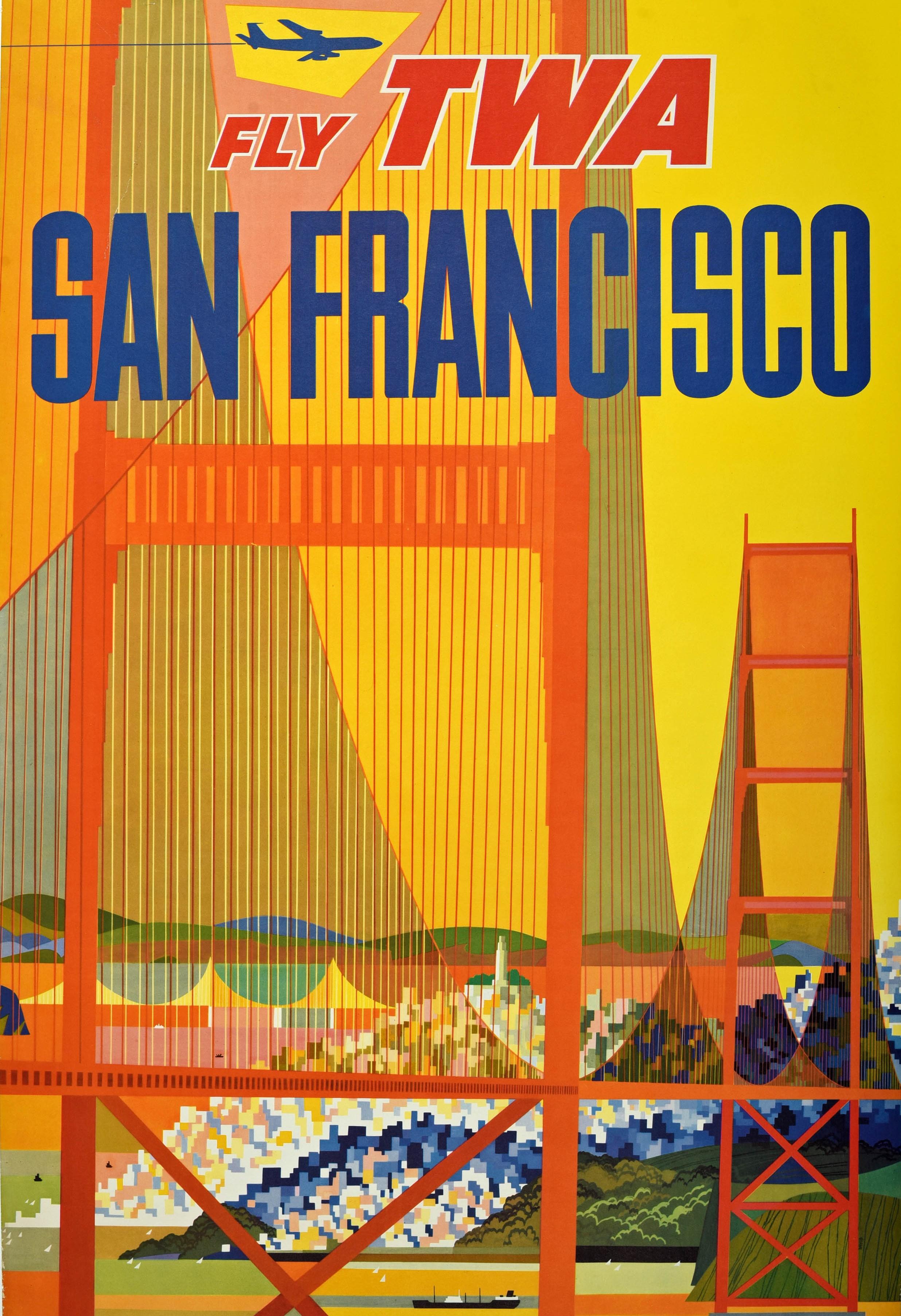 Original vintage travel poster - Fly TWA San Francisco - featuring a colourful view of a plane flying by the Golden Gate Bridge in California with sailing boats and a ship on the water and buildings behind the trees set against a yellow background,