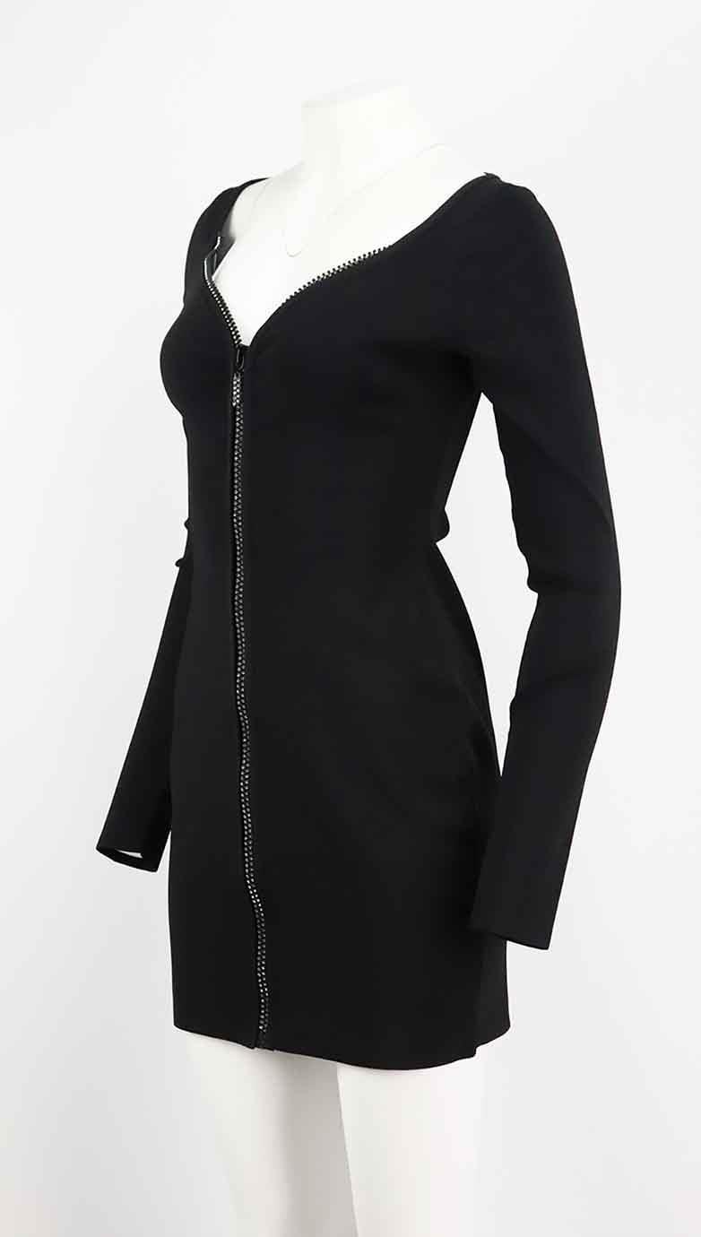 This mini dress by David Koma is designed in the label's signature body-con silhouette with iconic crystal-embellished zip down the front, it's made from stretch knit fabric which hugs your curves. Black rayon-blend. Slips on. 75% Rayon, 23% nylon,