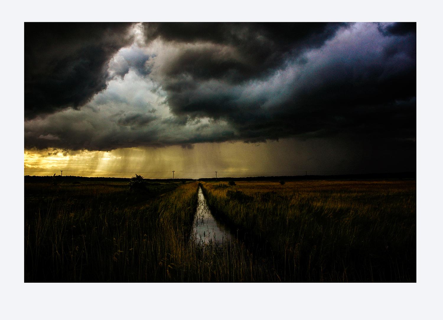 Rain Over Holkham - Photograph by David Koppel
