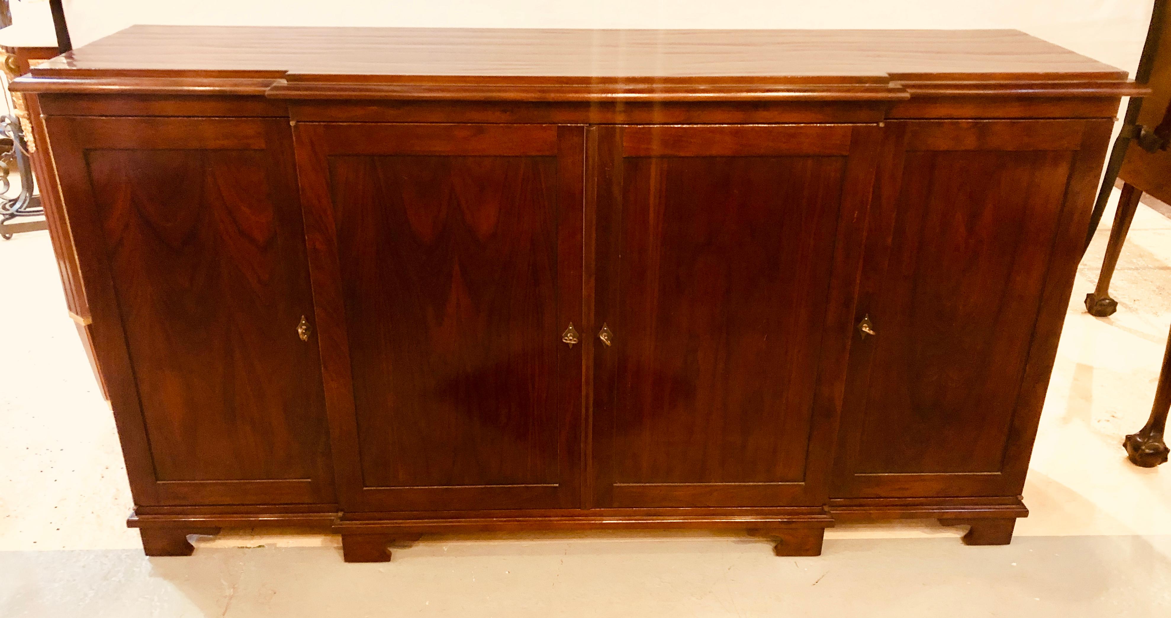 Branded David Latesta contemporary weatherly sideboard in mahogany of custom made to order quality. A rich fine brown mahogany finish on this large and impressive four door leading to fitted interior cabinet.
Atesta Studio collaborates with