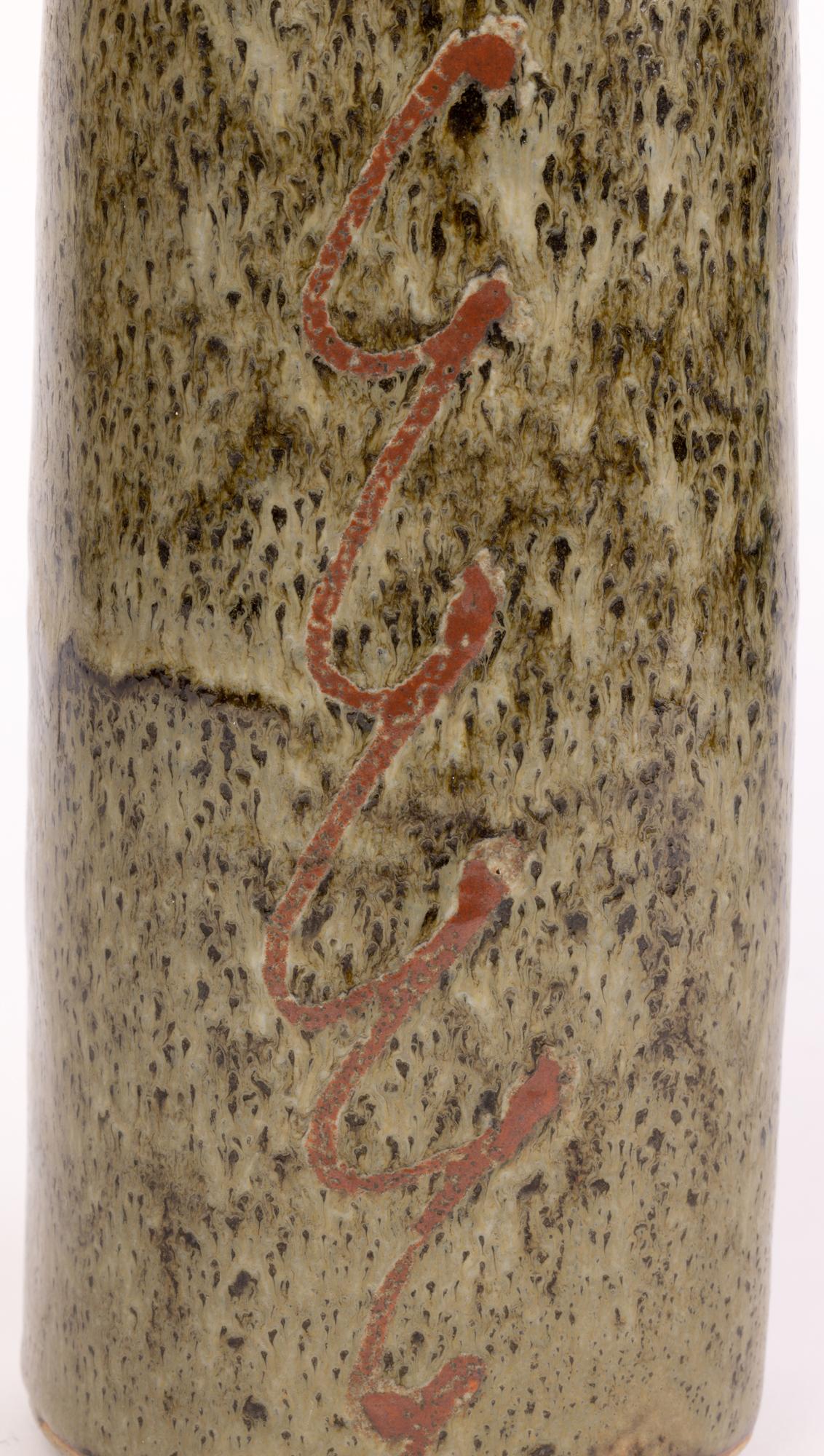 A stylish vintage Lowerdown pottery studio pottery vase of square form with abstract linear scroll designs by David Leach (British, 1911-2005) and dating from the 20th century. The tall stone ware vase has a square shaped body with rounded corners