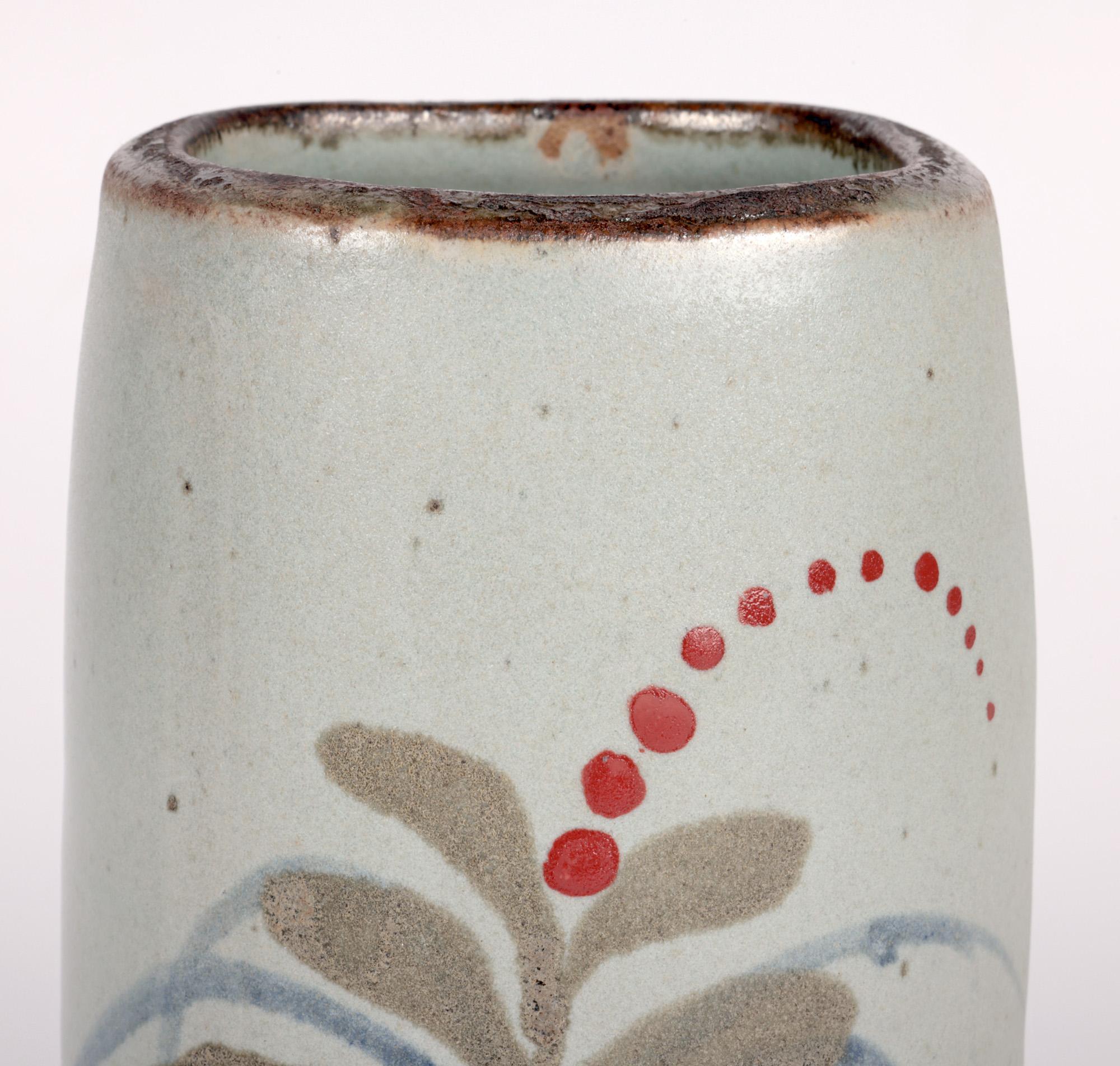 A very stylish Lowerdown Pottery stoneware studio pottery vase decorated in the foxglove pattern by renowned potter David Leach (British, 1911-2005) dating from around 1965. The heavily hand thrown vase stands on a flat unglazed rounded base with