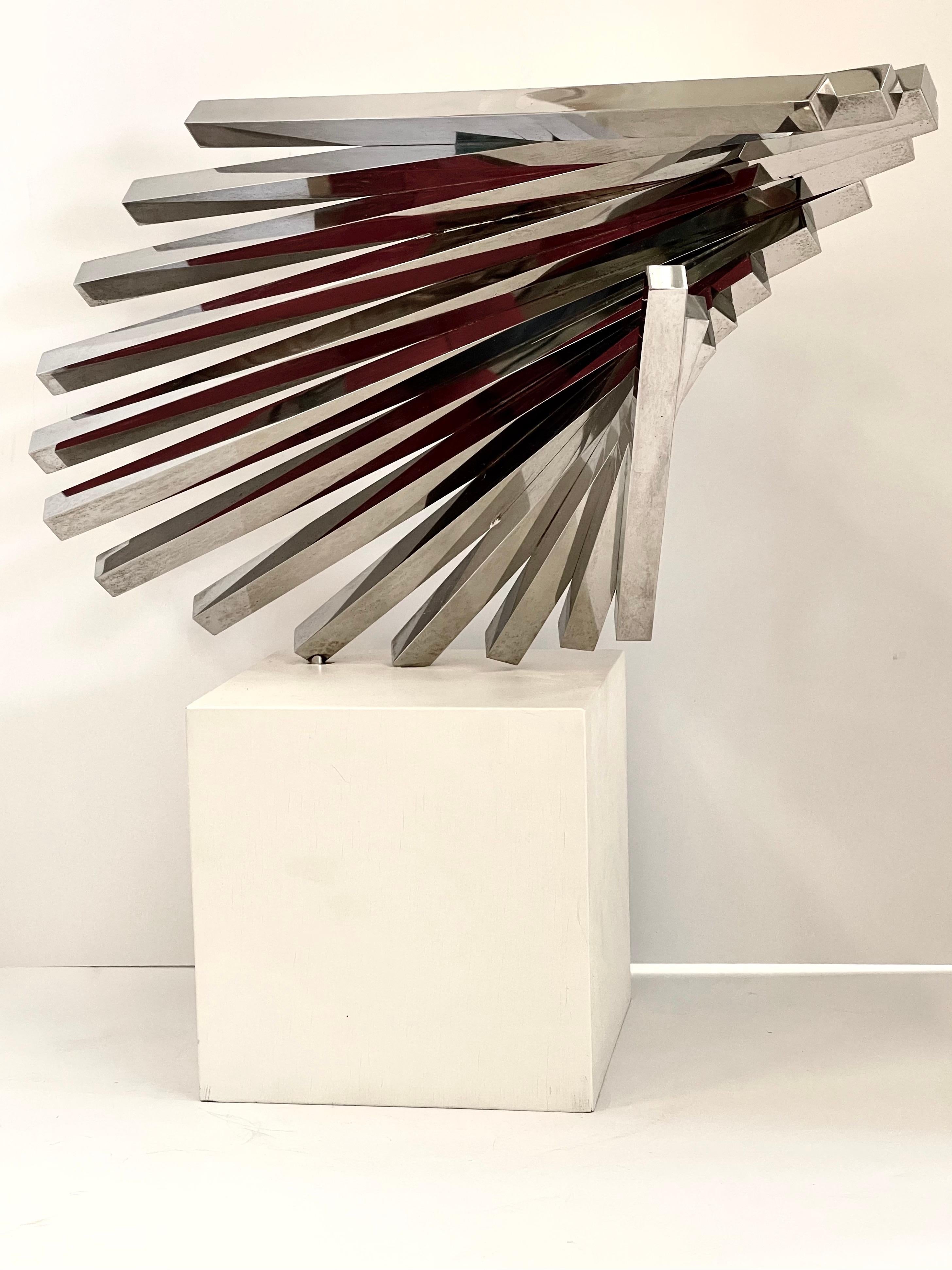 Steel sculpture by the noted artist David Lee Brown. It is marked with his name and date 1973. Mounted on a wood painted white base. Great form and movement. The artist passed away in 2016 in Southhampton, Long Island. There is a monumental example