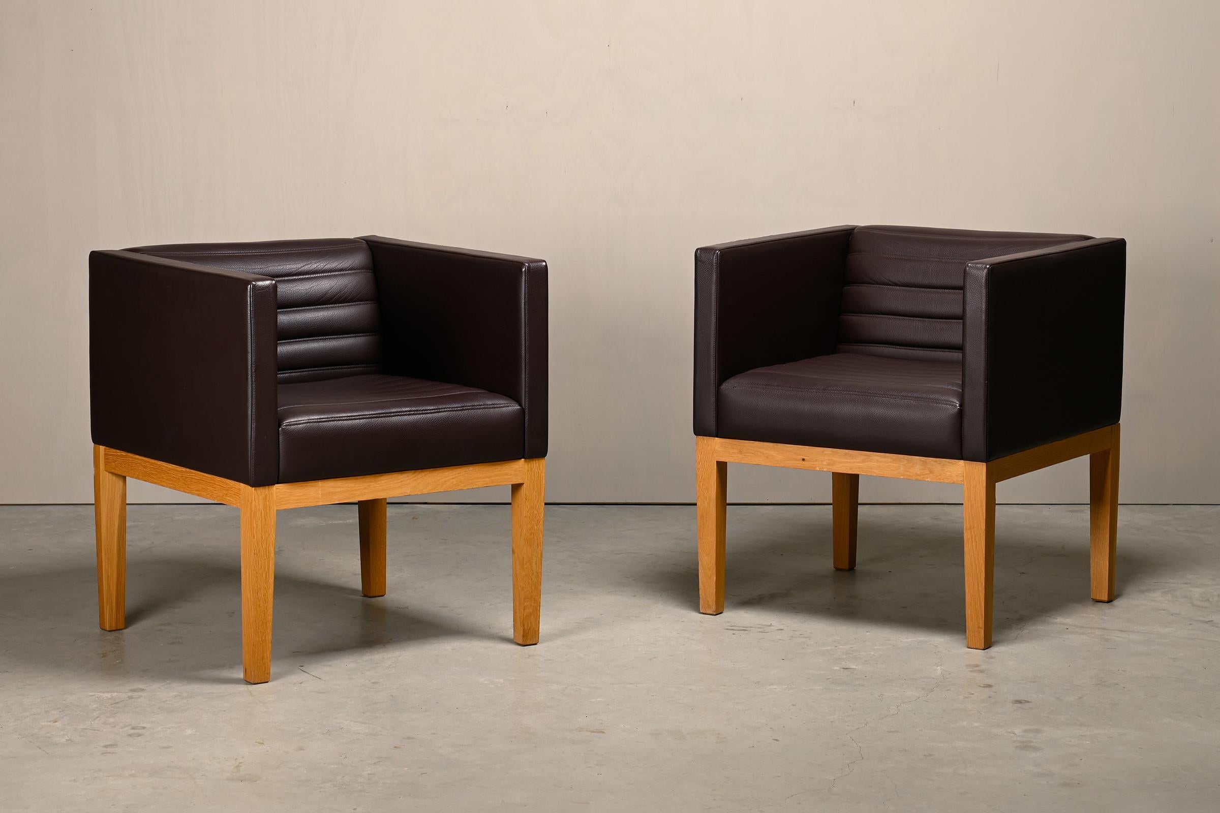 Pair of Dice Armchairs designed by David Linley for LINLEY, London. Good original condition with slight traces of use, mainly on the wooden frames.