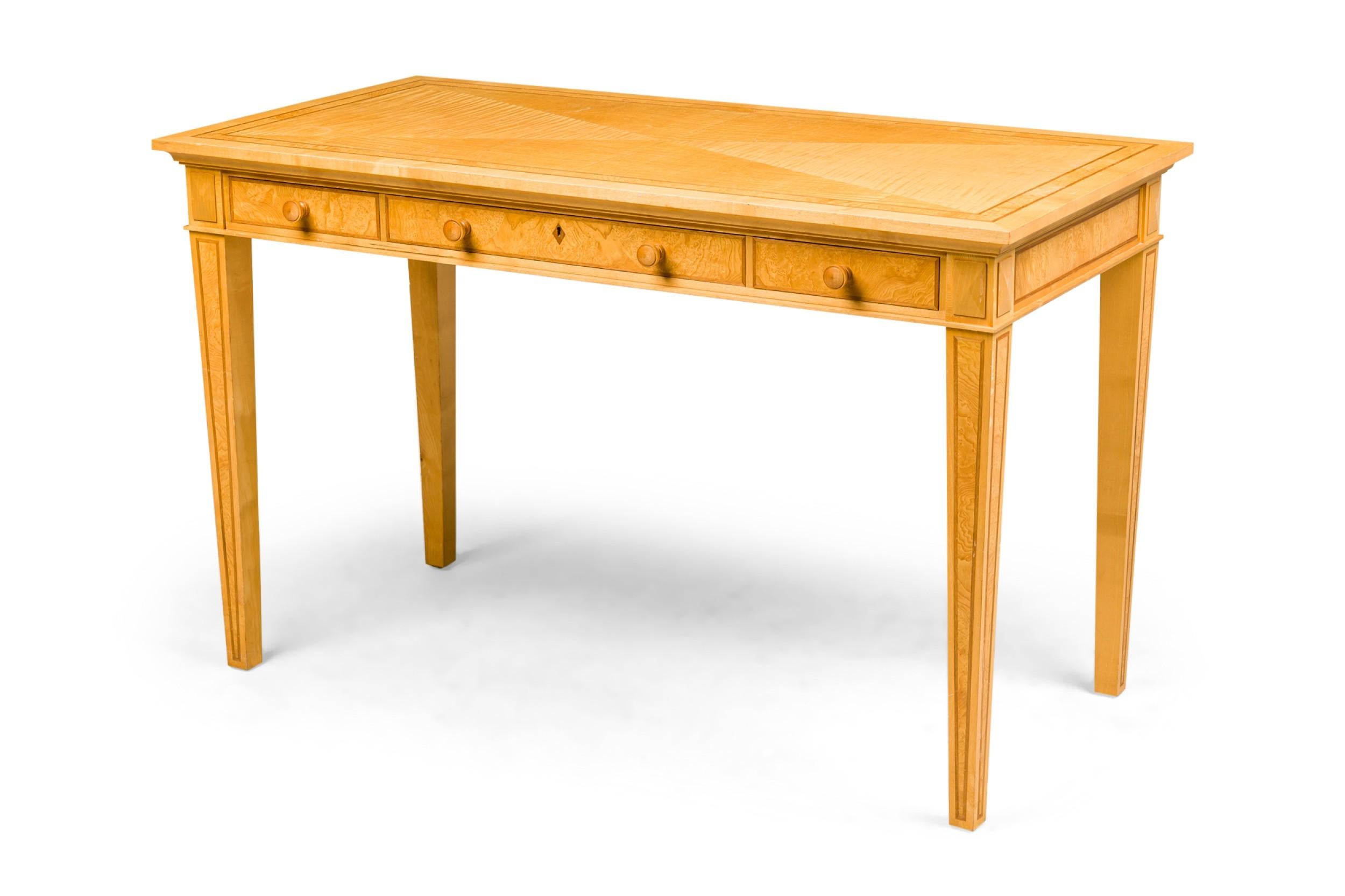 English Contemporary cherry, maple, and burr-ash writing desk having banded inlaid trim witth a diamond design top overthree drawers resting on tapered square legs (stamped: DAVID LINLEY)

several some small scratches on legs