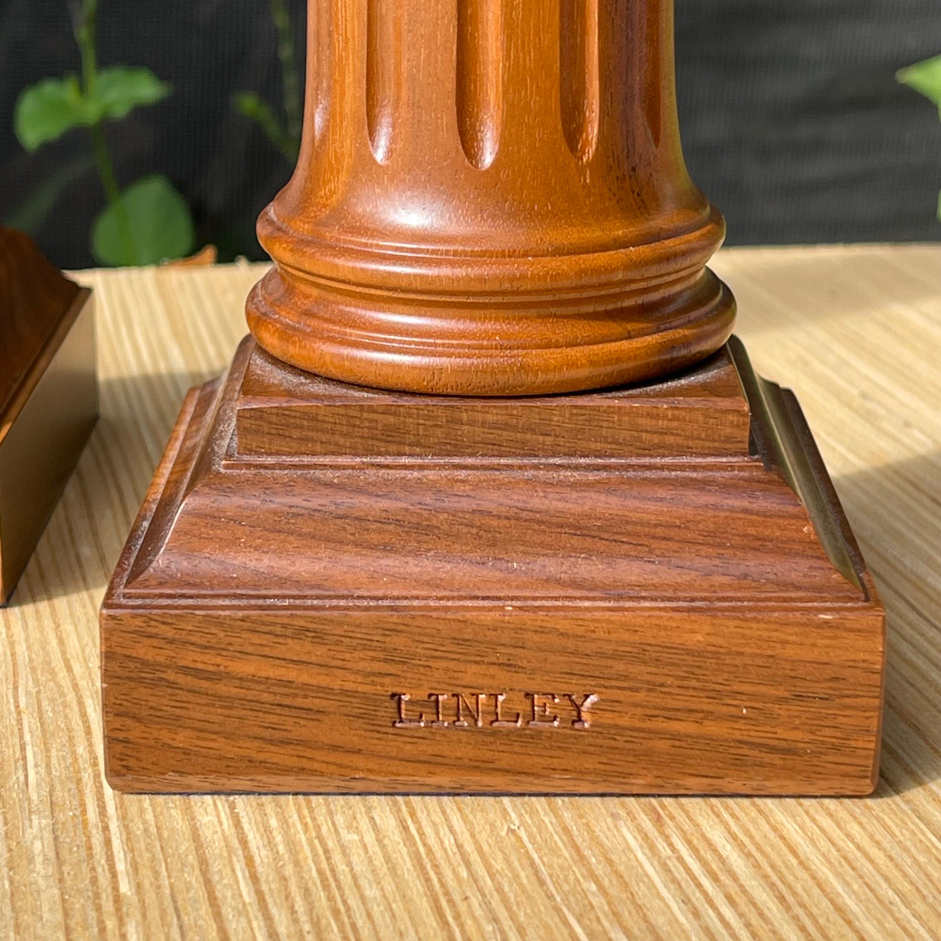 Handcrafted from fine walnut, these candlesticks evoke times past while their classical styling transcends trends.